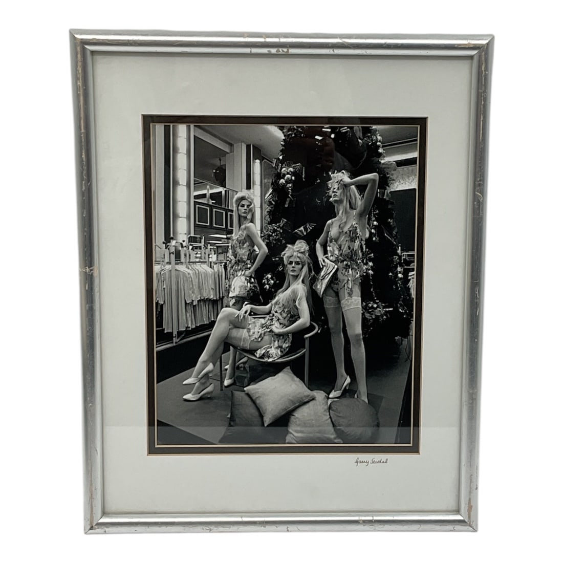 Photograph by Garry Seidel Framed Black and White Print: Black and white photograph by Garry Seidel depicting a staged interior scene with three women posed in a festive or decorative setting. The composition captures a candid yet stylized moment, rendered