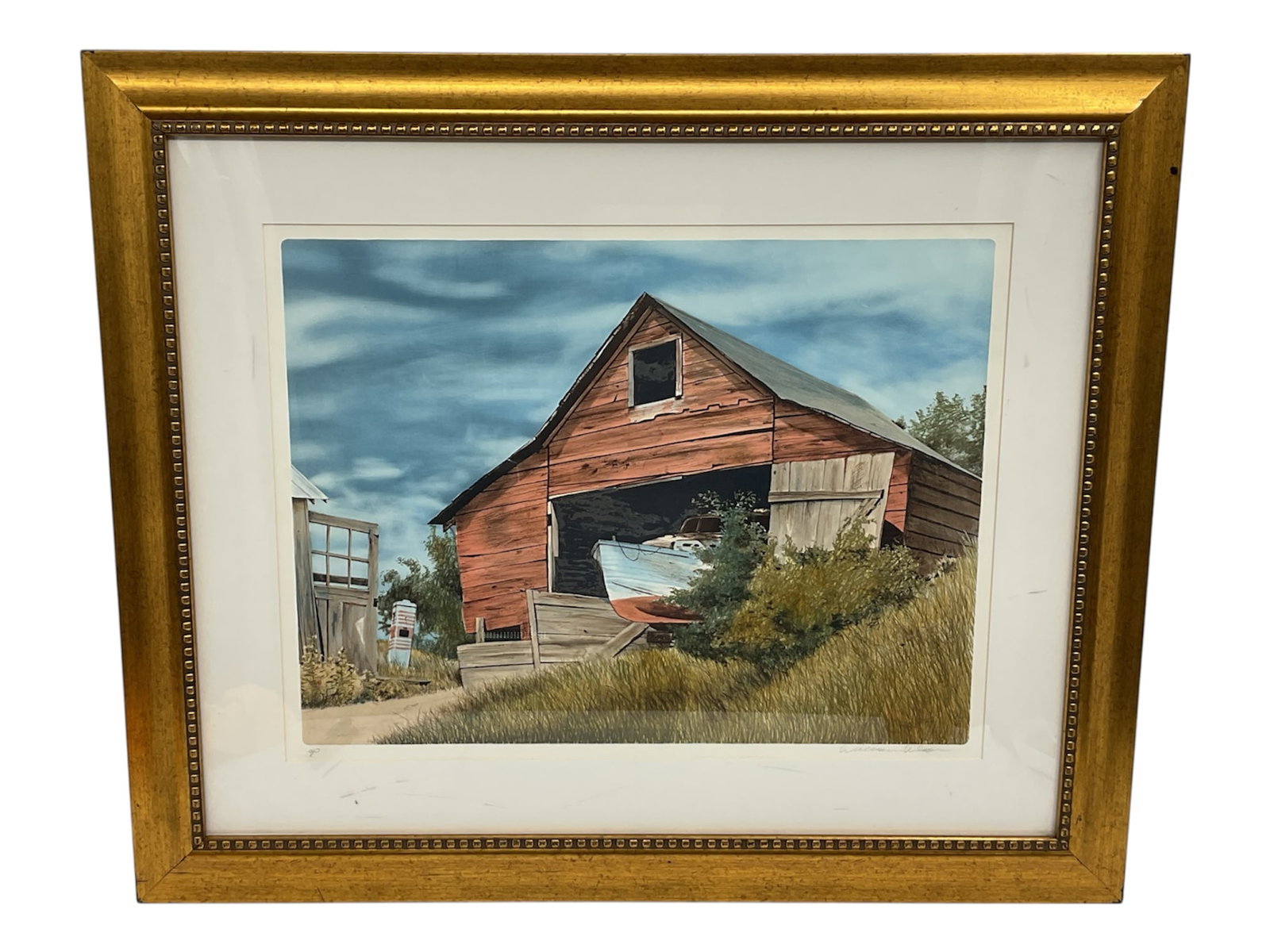 “Merrimac Sailor?? by William Nelson (American, 20th Century) Offset Lithograph: Coastal-themed offset lithograph titled Merrimac Sailor by American artist William Nelson. The scene depicts a weathered red barn set among tall grasses with a small sailboat stored inside, evoking