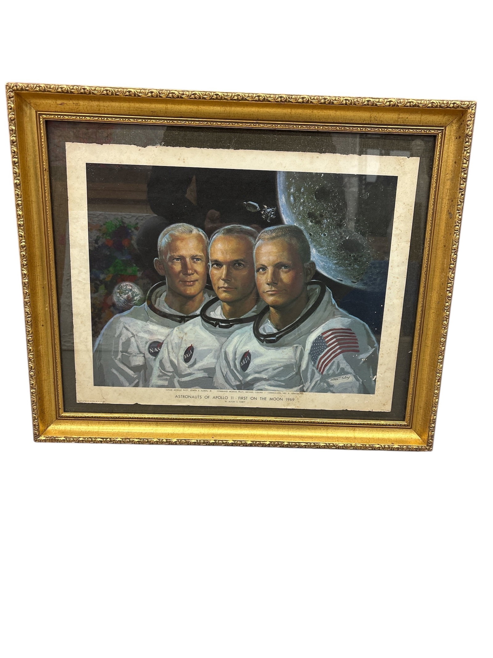Vintage 1969 "Astronauts of Apollo 11: First on the Moon" Framed Lithograph by Alton S. Tobey: Description This is a vintage, framed print commemorating the historic Apollo 11 mission, the first spaceflight to land humans on th