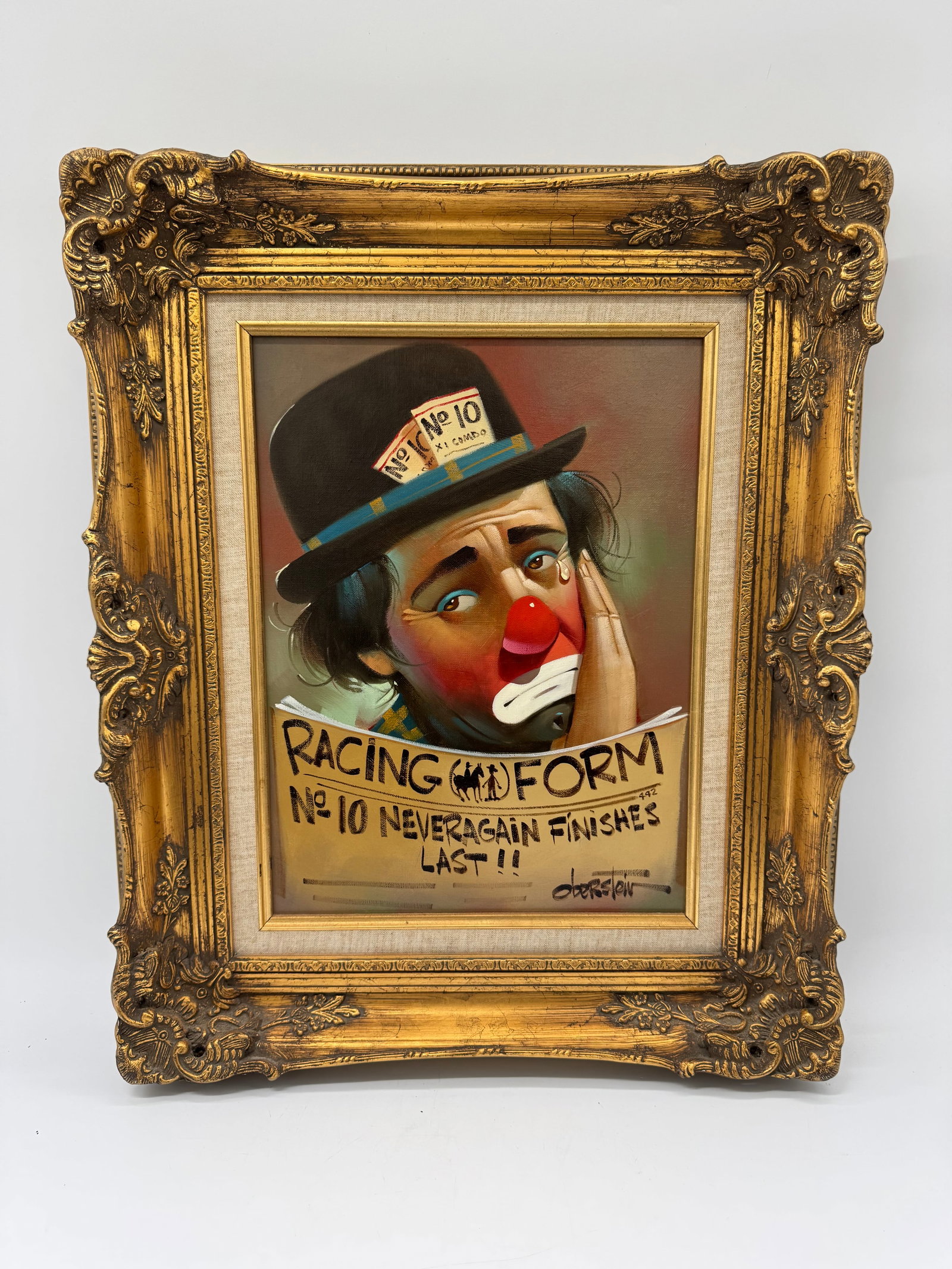 "Racing Form" by Chuck Oberstein (American, 1935-2002) Oil on Canvas: Description: painting depicting a clown with "Racing Form" text. Signed lower right. Presented in an ornate gilt frame. Signed by the artist bottom right. Medium: Oil on canvas