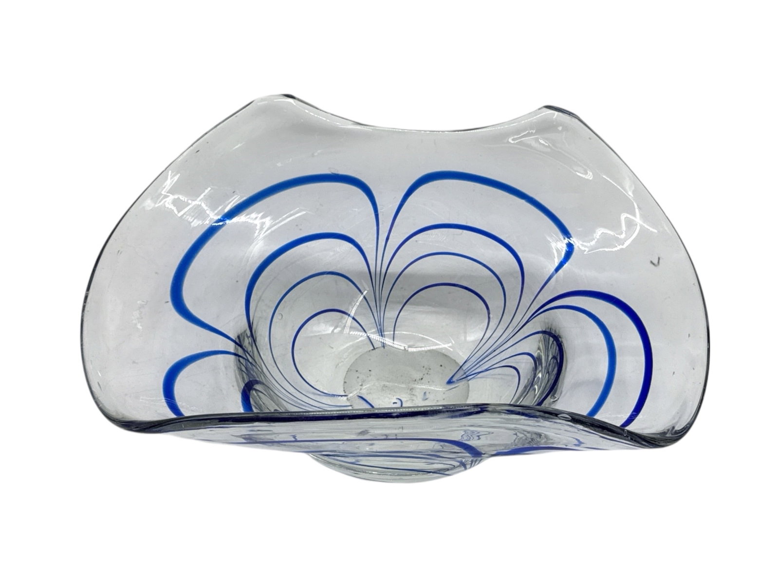 Modern Clear Art Glass Bowl with Blue Swirl Design: A modern clear art glass bowl featuring a freeform organic silhouette accented with internal blue swirl line decoration. The flowing cobalt-style lines radiate outward in a symmetrical fan-like motif,