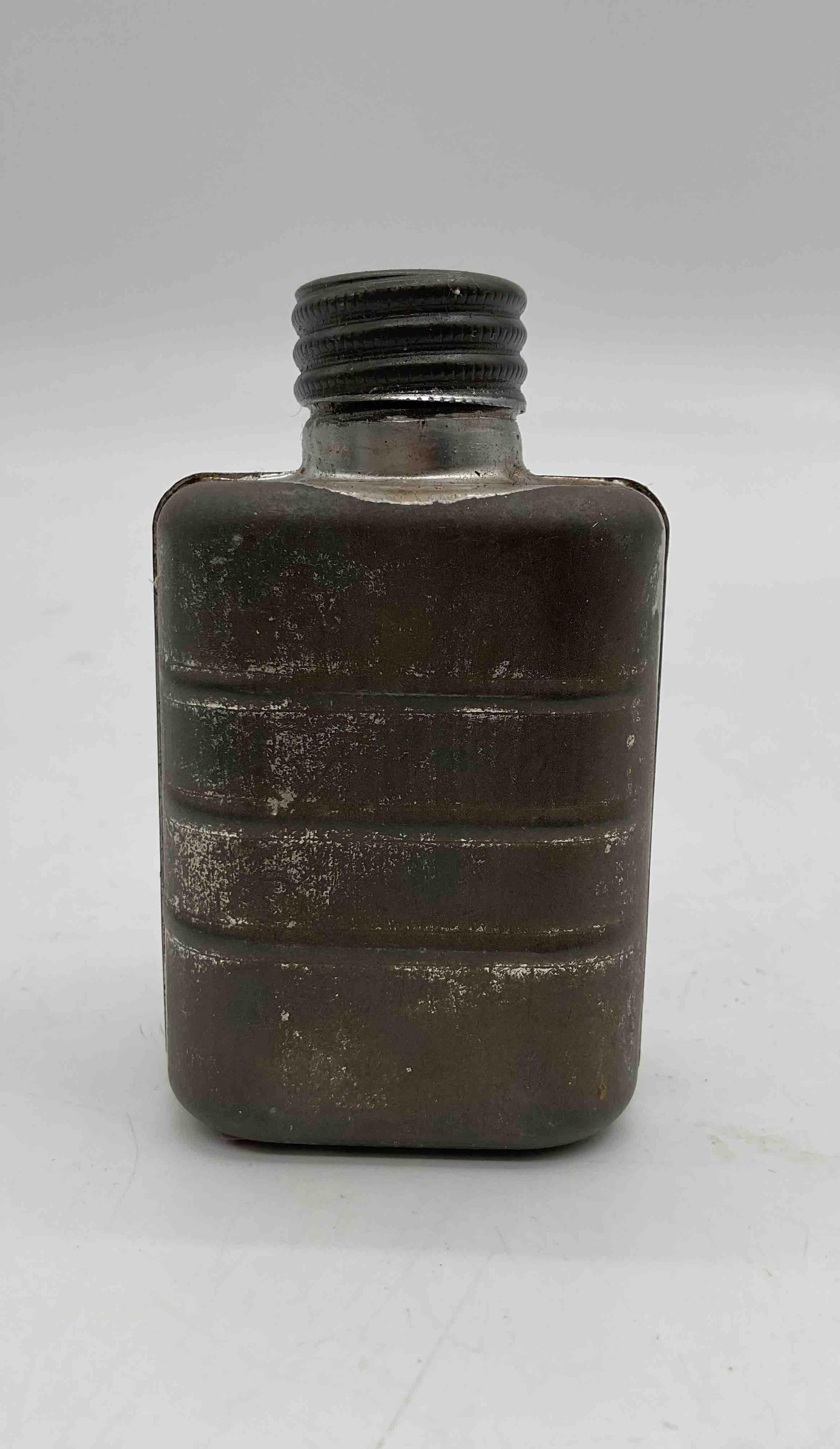 Vintage Military Metal Canteen Flask: Rectangular metal canteen flask with threaded screw-top opening, likely mid-20th century military issue. Compact design suggests use as a field or personal utility flask, showing age-related wear and