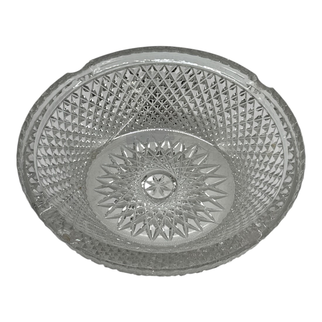 Cut Glass Ashtray with Starburst and Diamond Pattern: Classic cut glass ashtray featuring a scalloped rim and an allover diamond-pattern design with a central starburst motif. The faceted surface reflects light beautifully, making it an attractive vintag