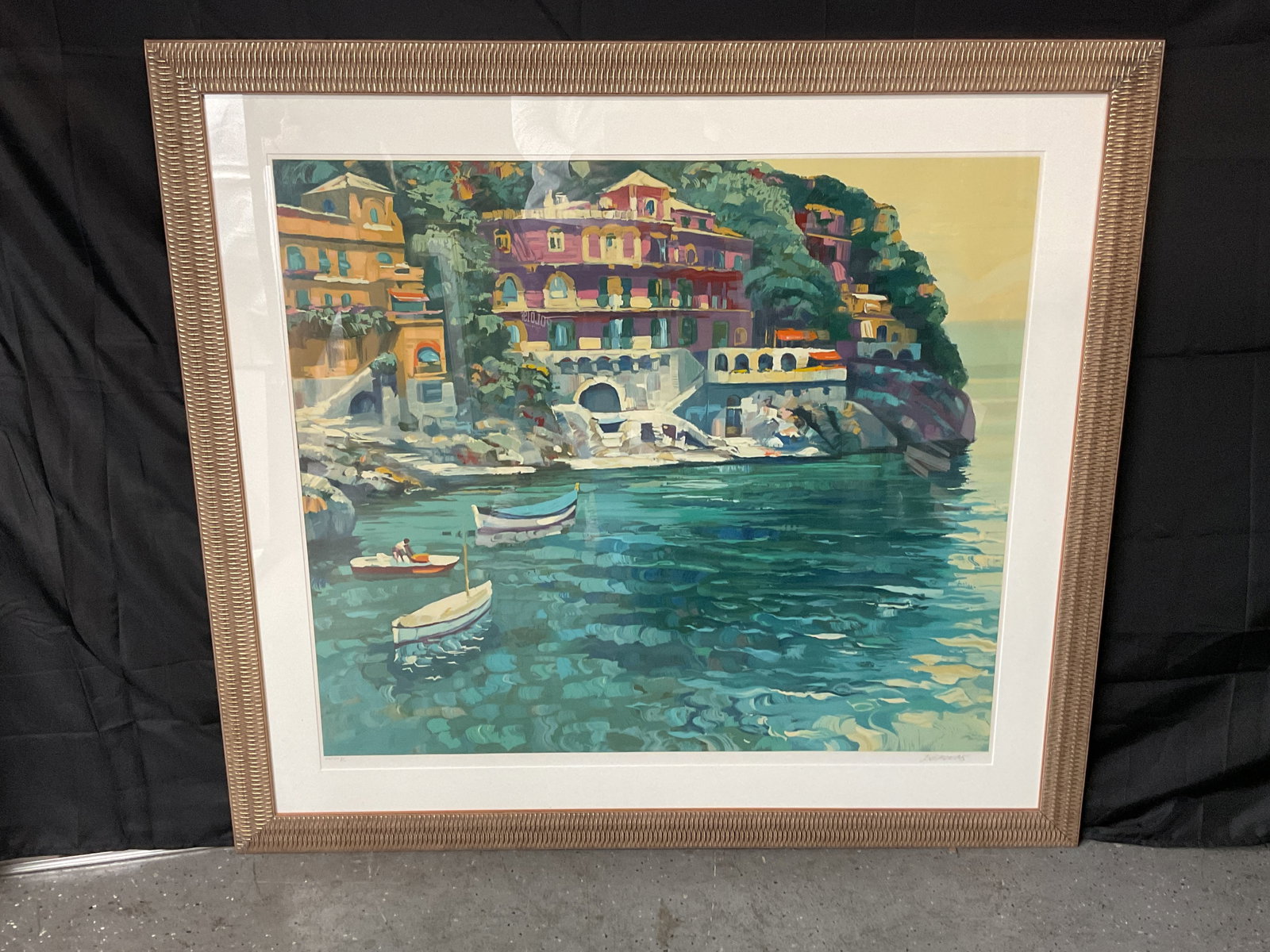 Howard Behrens "Villa" Lithograph w/ COA: Framed lithograph titled "Villa" by Howard Behrens, depicting a coastal Italian scene with boats. Signed and numbered XXXVIII/C. Dimensions: H45in L49in