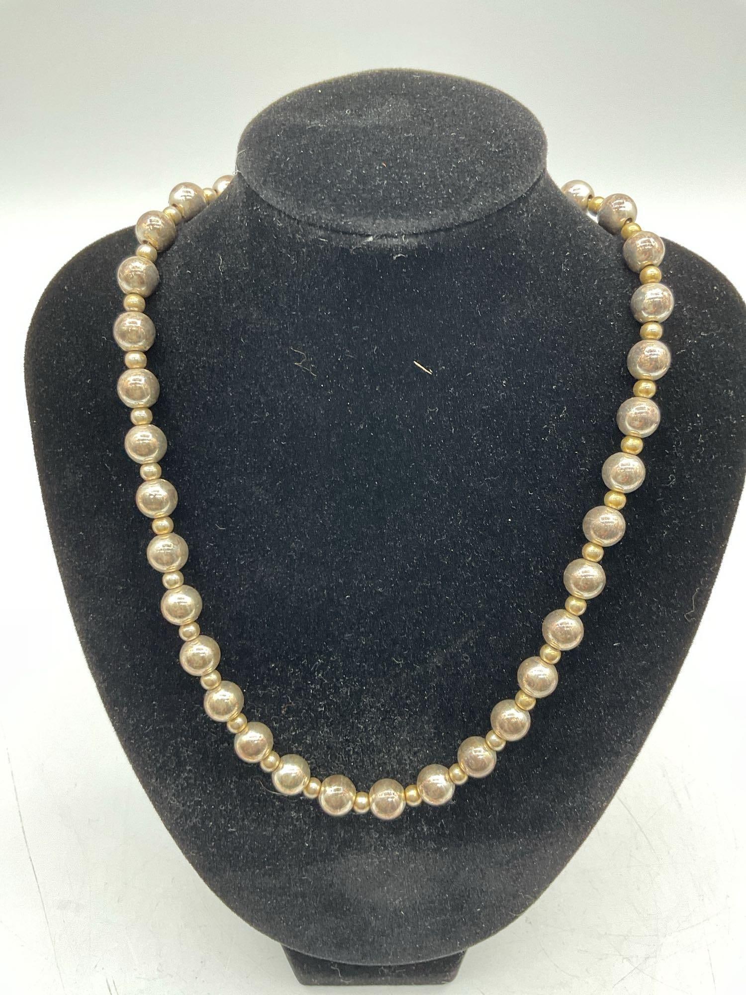 Faux Pearl Necklace: Faux Pearl Necklace Dimensions: L16in Medium: Imitation pearls and metal findings.