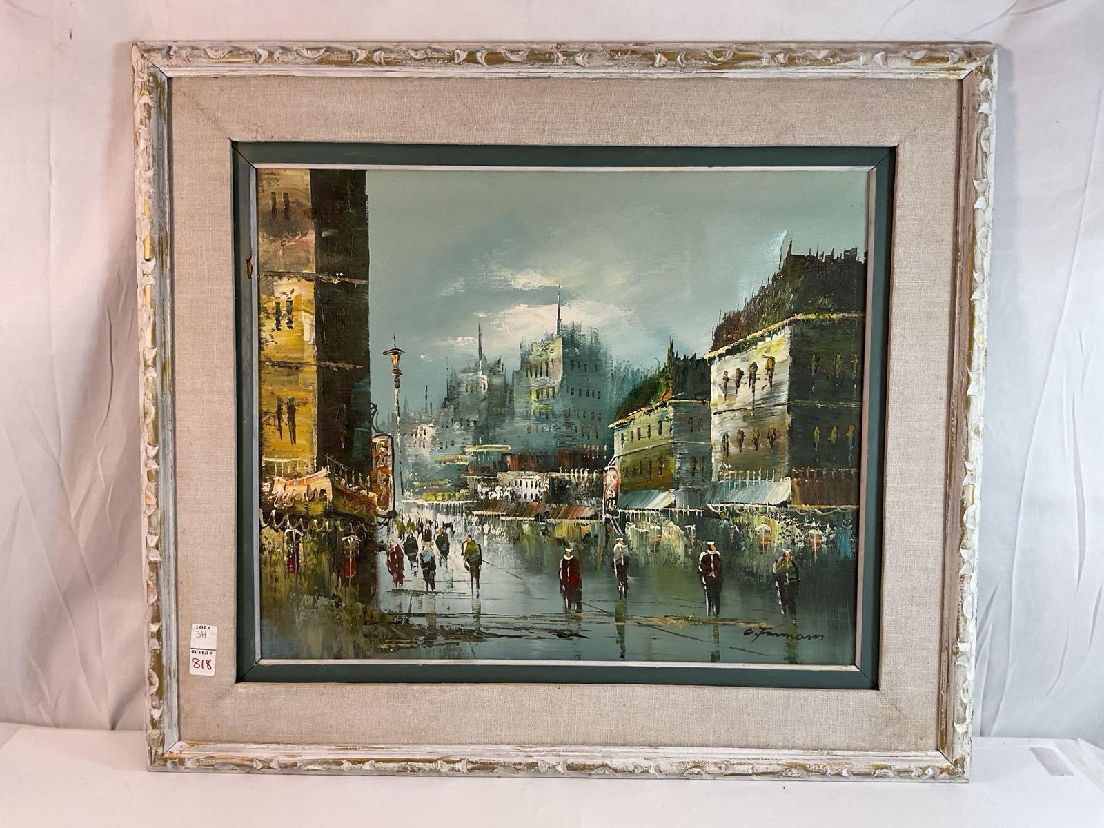European Cityscape Oil Painting Signed "C. Furmam" in Vintage Frame: This is a vibrant cityscape oil painting, depicting a bustling European street scene at dusk or evening, with historic buildings, glowing streetlights, and figures walking along wet cobblestone street
