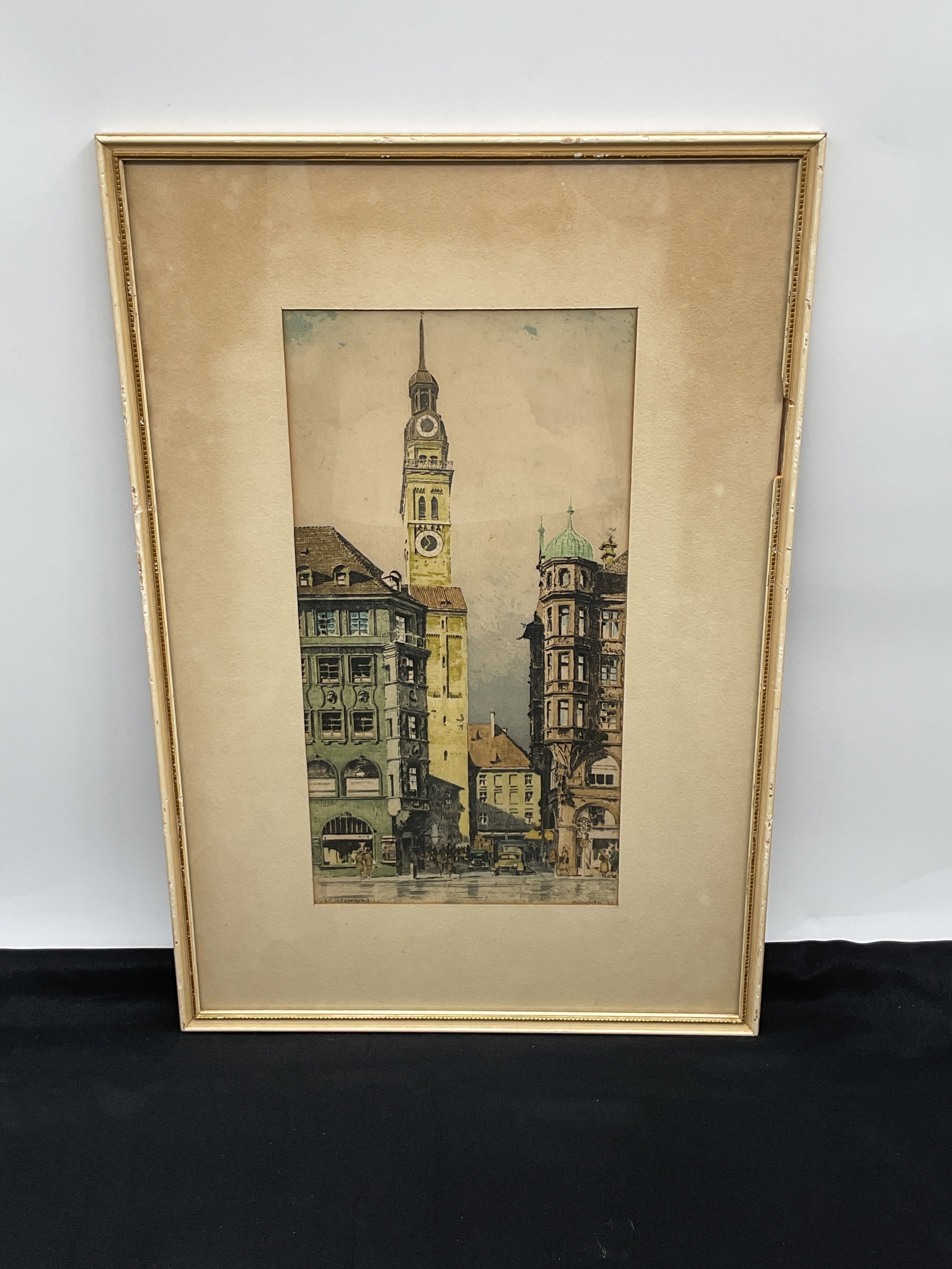 Traugott Hermann Rüdisühl "Munchen" Framed Print: Framed print titled "Munchen" by Traugott Hermann Rüdisühl, depicting a cityscape with a prominent clock tower. Dimensions: H22in L15in. The print is signed "Veit Starnberg&qu