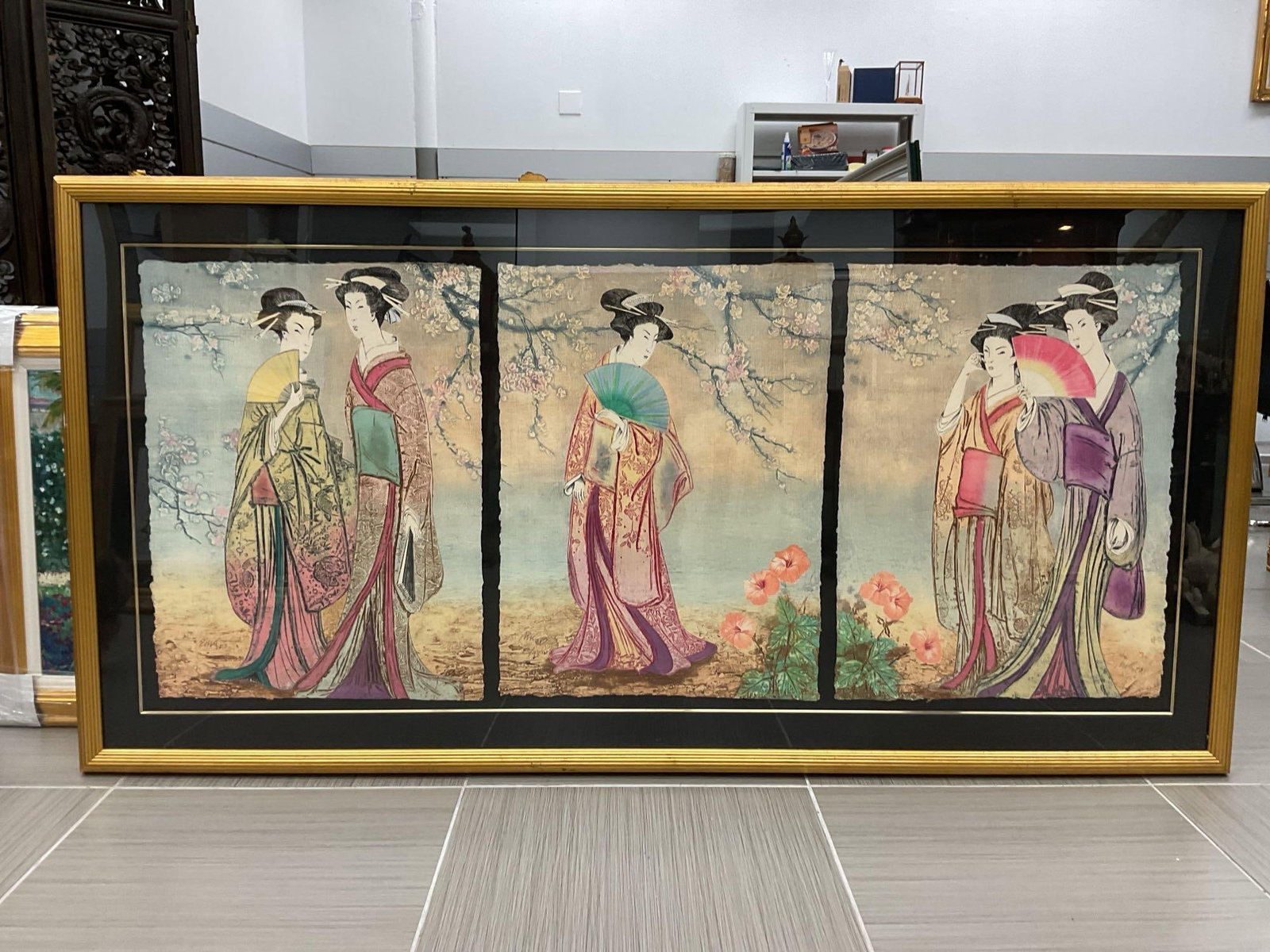 "Cherry Blossoms" by Mikulas Kravjansky:  "Cherry Blossoms" by Mikulas Kravjansky is a framed triptych featuring three elegant Geishas in traditional Japanese attire, set against a serene background of cherry blossoms and flor
