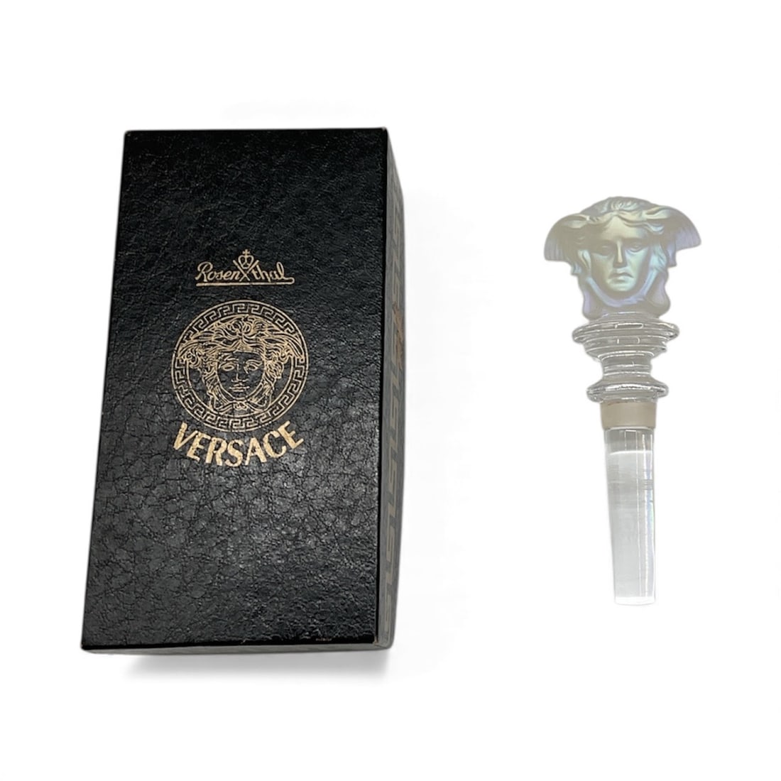RARE Iridescent Rosenthal Versace Medusa Crystal Bottle Stopper with Presentation Box: Luxury bottle stopper featuring the iconic Versace Medusa head in clear molded crystal. Comes with the original Versace presentation box. Elegant designer accessory suitable for bar display or collect