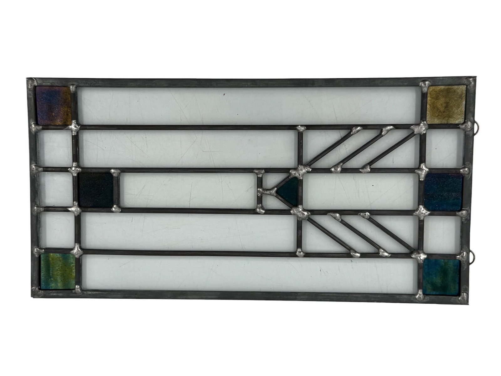 Tree of Life Window by Frank Lloyd Wright (USA, 1867-1959) Stained Glass: A stained glass panel featuring a geometric design inspired by the Darwin D. Martin House Tree of Life patterns. The composition consists of rectangular white opalescent glass panes accented by square