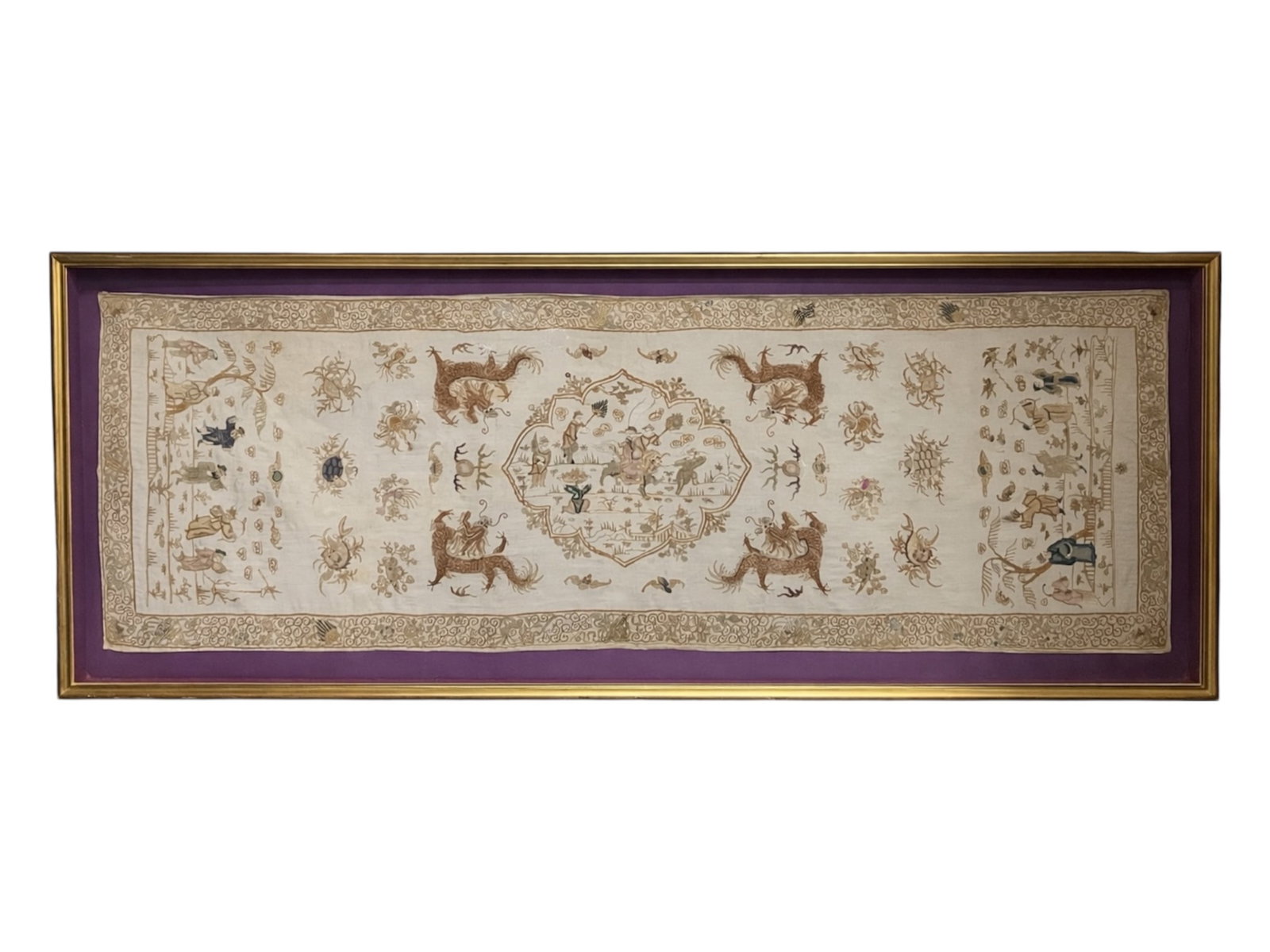 Large Chinese Horizontal Silk Embroidery Panel with Dragons, Qilin, and Immortals Qing Dynasty 19th: This large-scale horizontal textile panel features an intricate sequence of traditional Chinese auspicious motifs from the late Qing Dynasty. The central narrative depicts celestial figures navigating