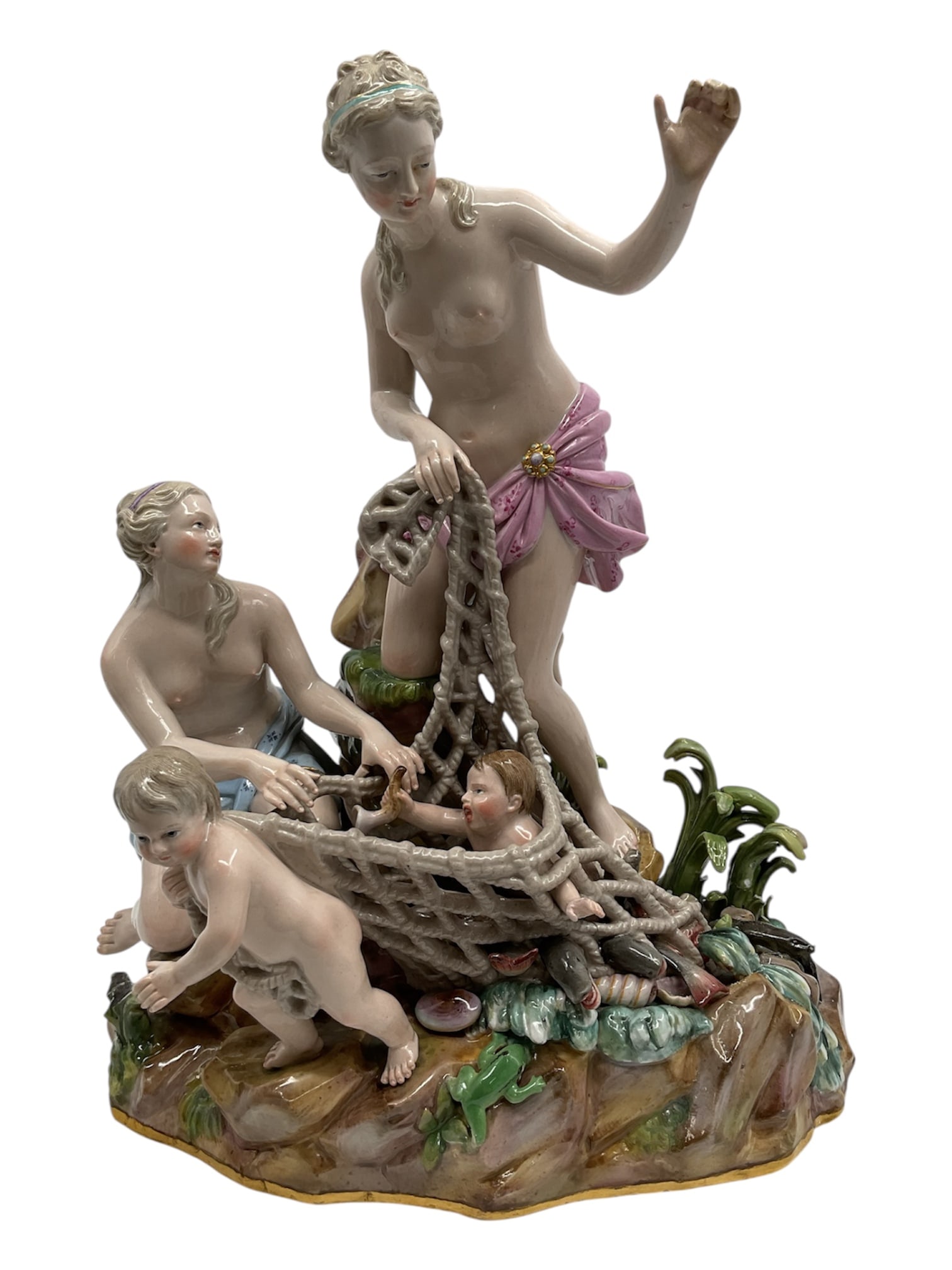“The Capture of an Infant Triton?? Meissen Porcelain Figural Group: Antique Meissen porcelain figural group titled The Capture of an Infant Triton, depicting a lively mythological scene rendered in finely modeled porcelain. The composition features a standing female f
