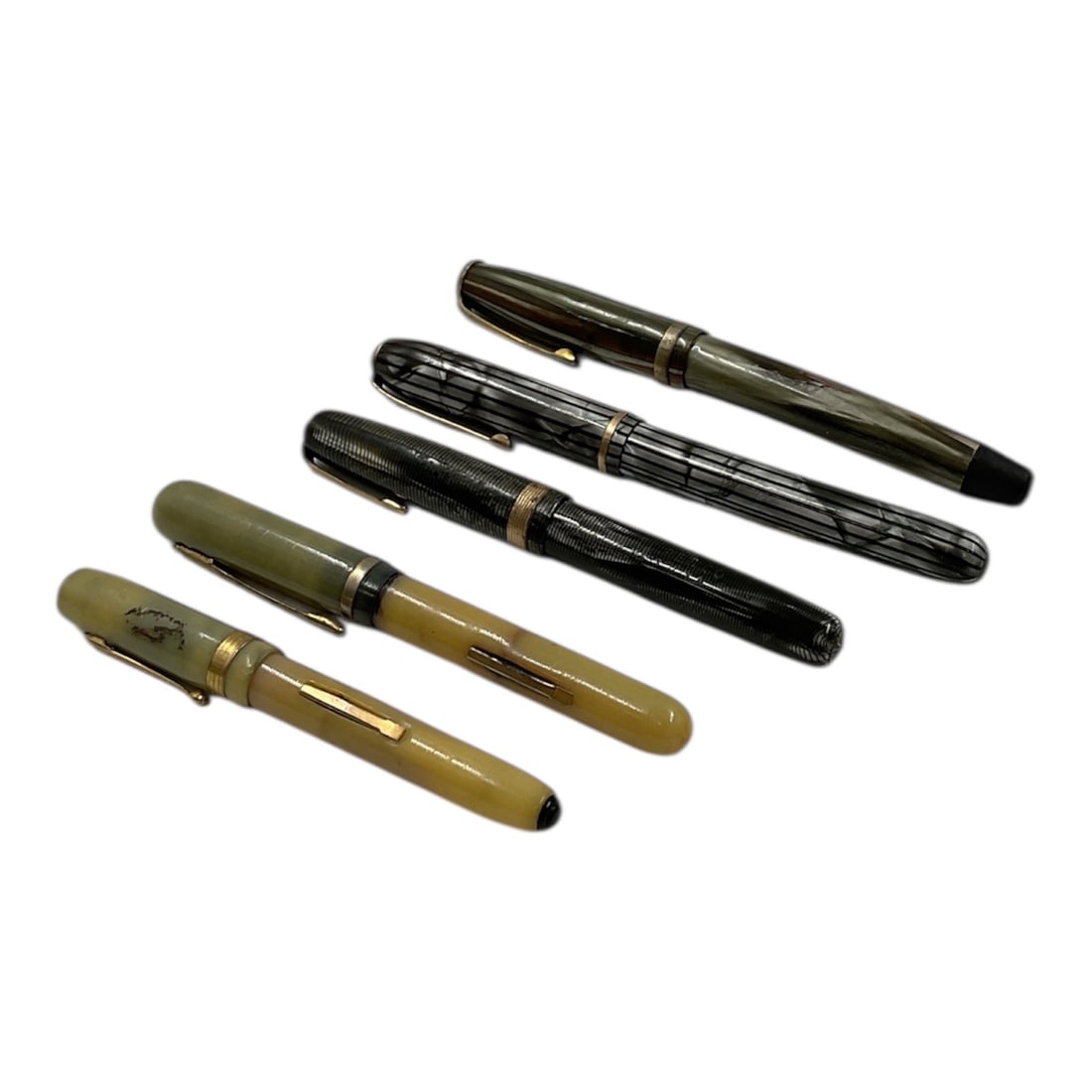 Collection of 5 Vintage Fountain Pens Including 14K Nib Examples: Group of five vintage fountain pens in varying styles and finishes, including two examples marked with 14K gold nibs. The assortment features classic mid-century designs with a mix of celluloid and pl