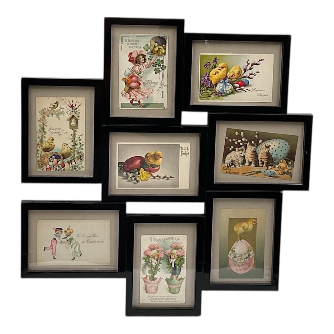 Collection of Antique Easter Postcards in Coordinated Framed Display: Charming collection of antique Easter postcards presented in a coordinated wall display of eight black frames. The postcards feature colorful period illustrations including chicks, rabbits, florals, a