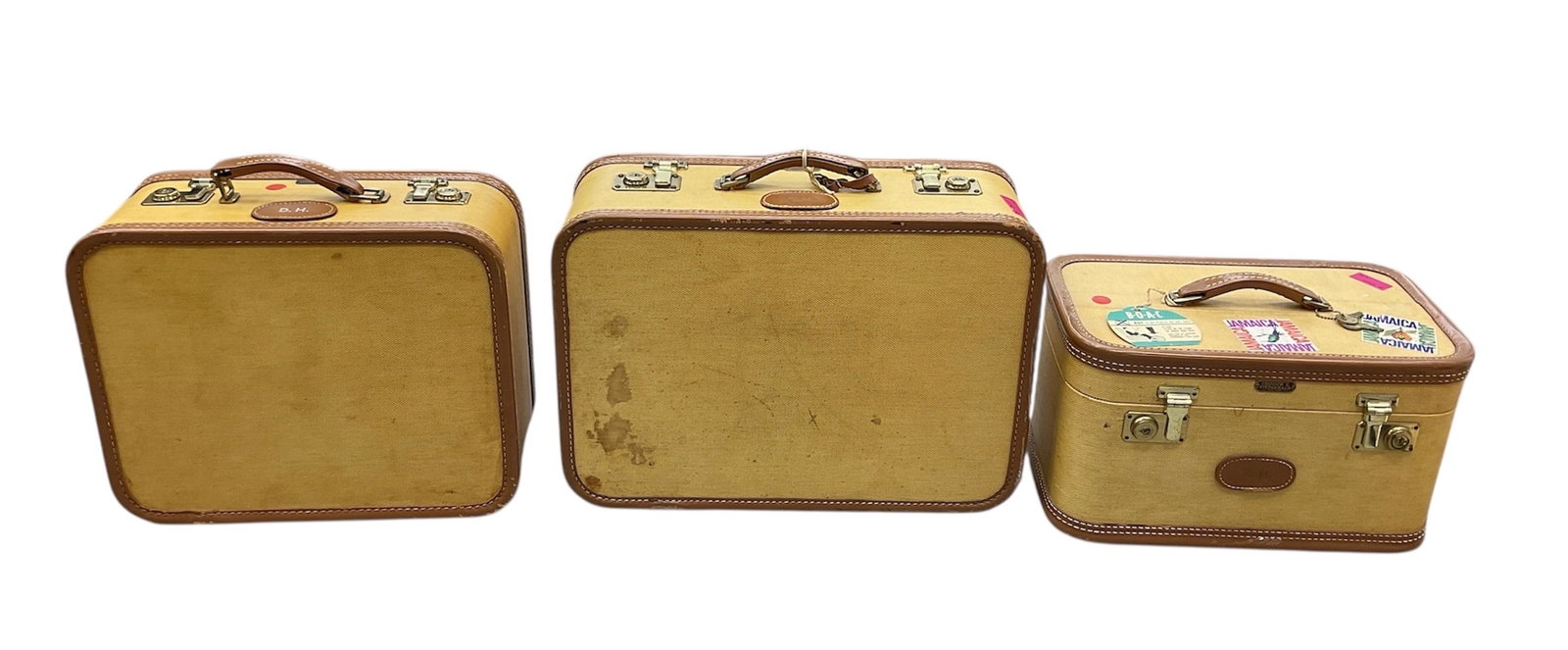 Three-Piece Vintage Luggage Set by Crouch & Fitzgerald (USA, Est. 1839) Canvas and Leather: This coordinated three-piece travel set from the renowned New York maker Crouch & Fitzgerald features a classic mid-century aesthetic. Each piece is constructed from a durable cream-colored canvas