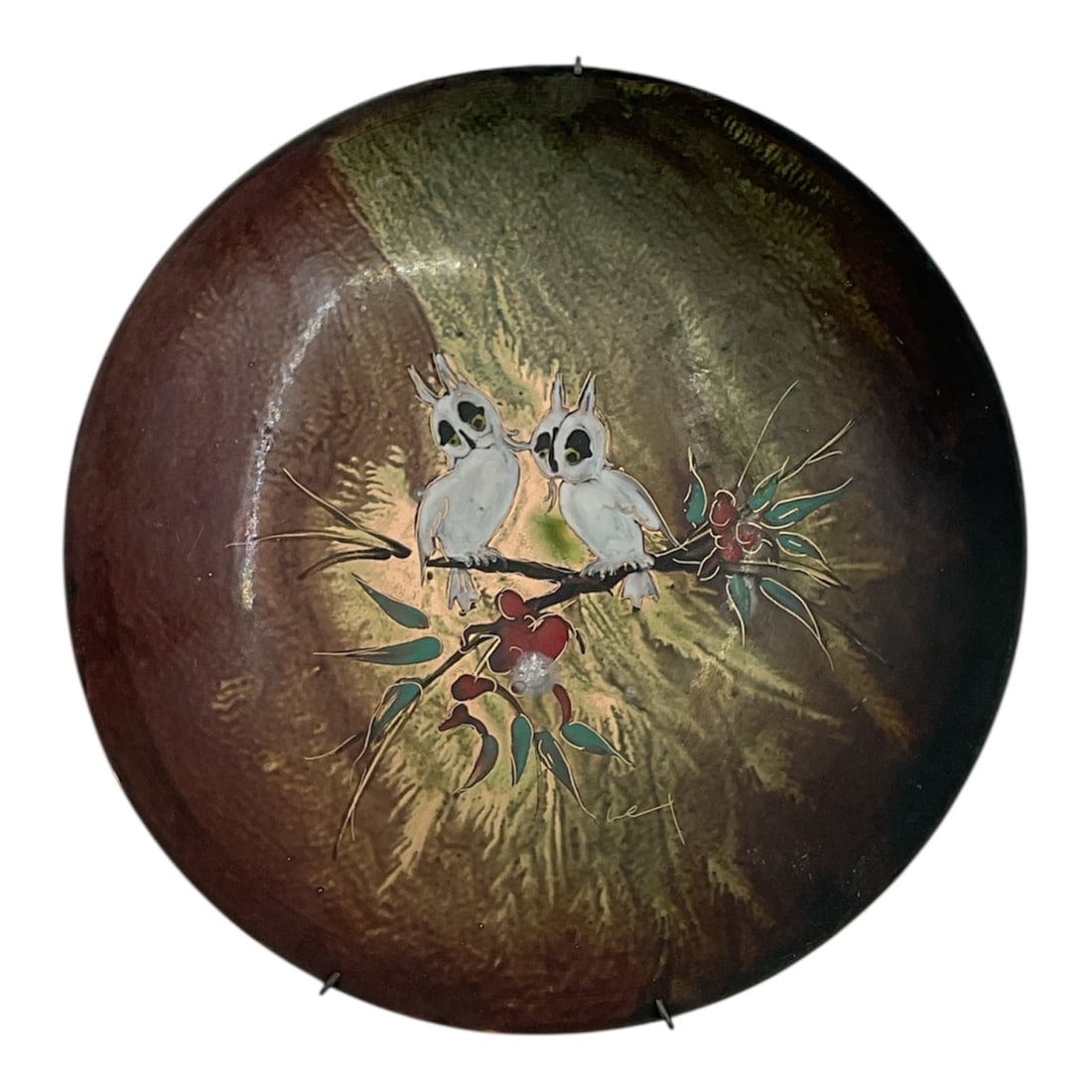 Mid-Century Dutch Hand-Painted Enamel Wall Plate with Owls: Description:Mid-century decorative enamel wall plate, hand-painted in Holland, featuring a charming pair of owls perched on a branch with stylized foliage and berries. The composit