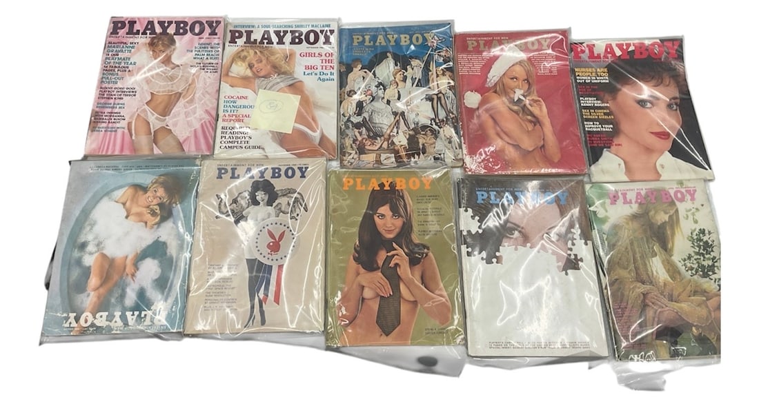 Playboy Magazine Group Including 10 Vintage Issues: A collection of Playboy magazines featuring 10 vintage issues with iconic cover art and photography. The group showcases classic Playboy imagery, celebrity features, and period advertising, reflecting