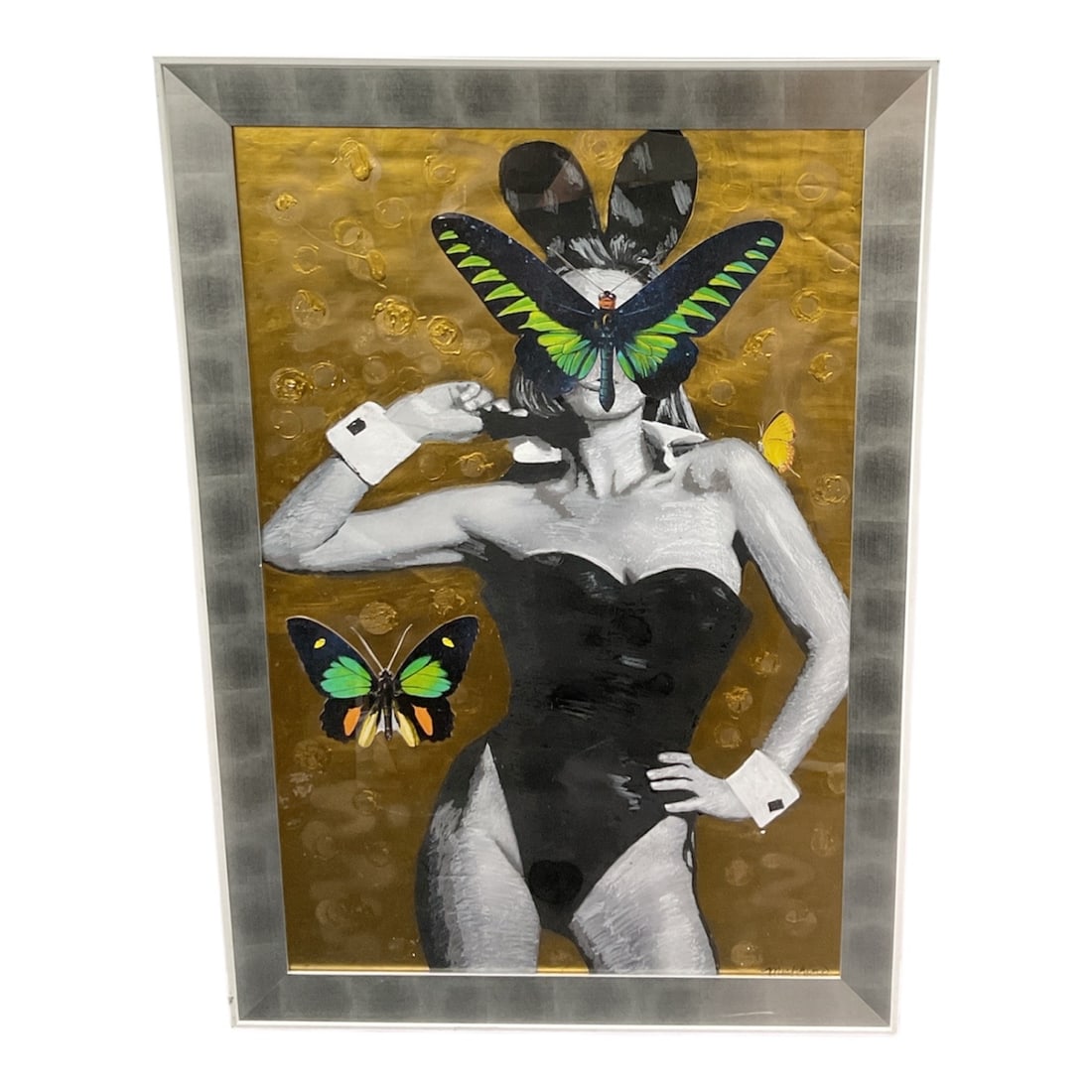 Butterfly by Michelle Mishkin: he piece shown in the image is a multimedia work by Michelle Mishkin that blends vintage-style photography with surreal, colorful accents.Central Subject: A black-and-white,