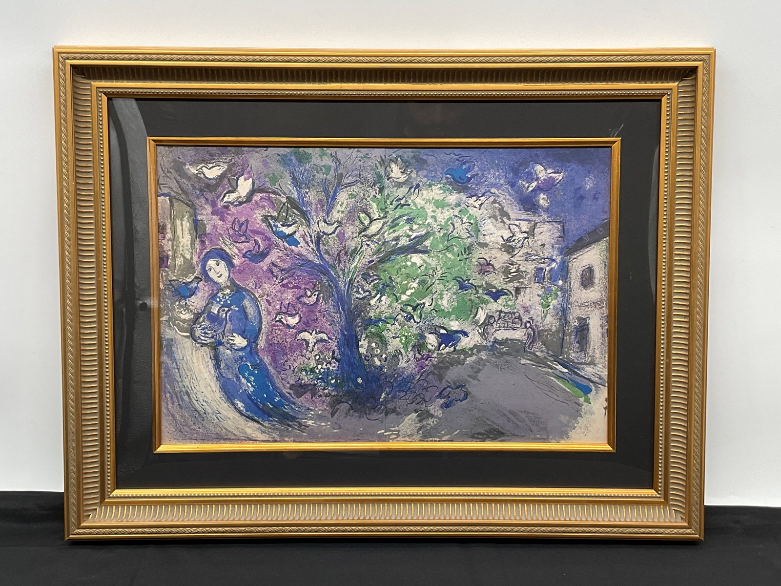 Marc Chagall "The Bird Chase" Lithograph w/ COA: Lithograph titled "The Bird Chase" by Marc Chagall, published by George Braziller in New York, 1977. Image depicts a woman and birds in a landscape. Framed and glazed. Dimensions: 20 x 26 in