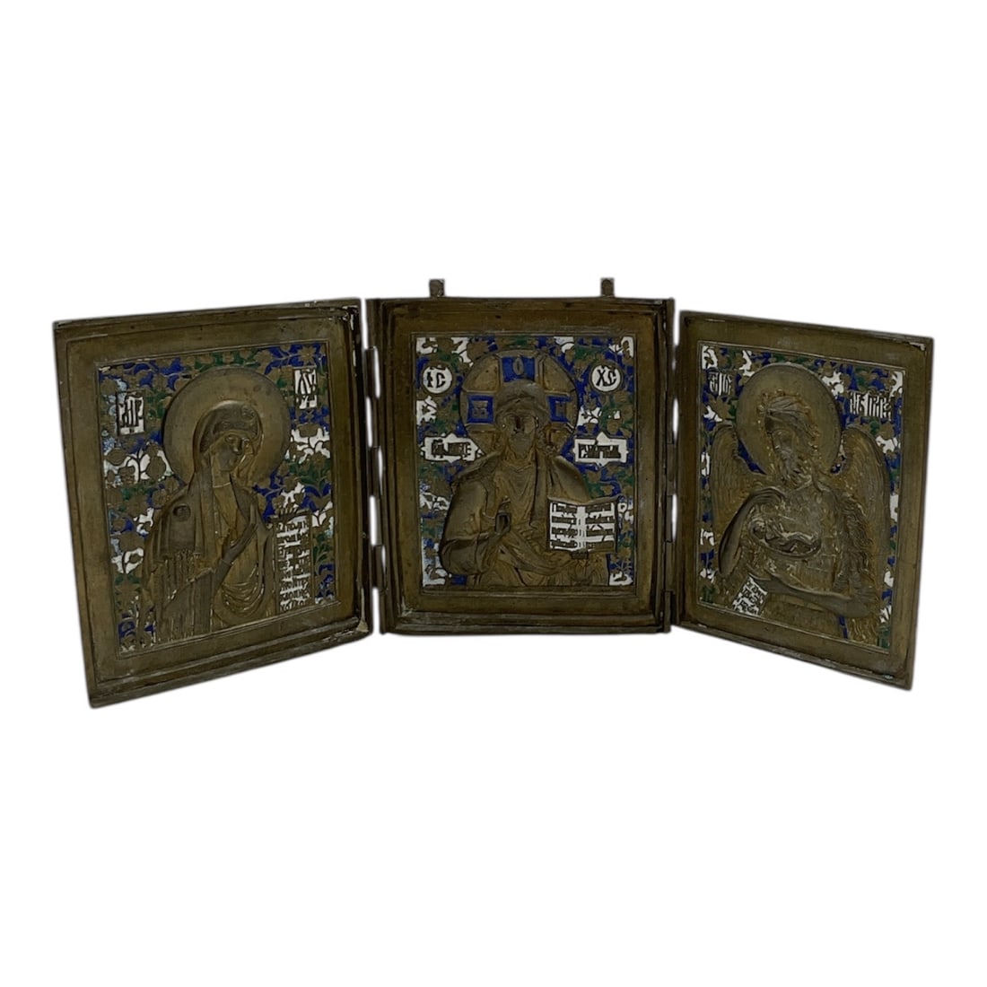 Russian Deesis Triptych Traveling Icon (19th Century) Brass and Enamel: This is a three-paneled folding traveling icon, known as a triptych, featuring the Deesis (intercession) theme. The central panel depicts Christ Pantocrator, flanked by the Virgin Mary on the left and