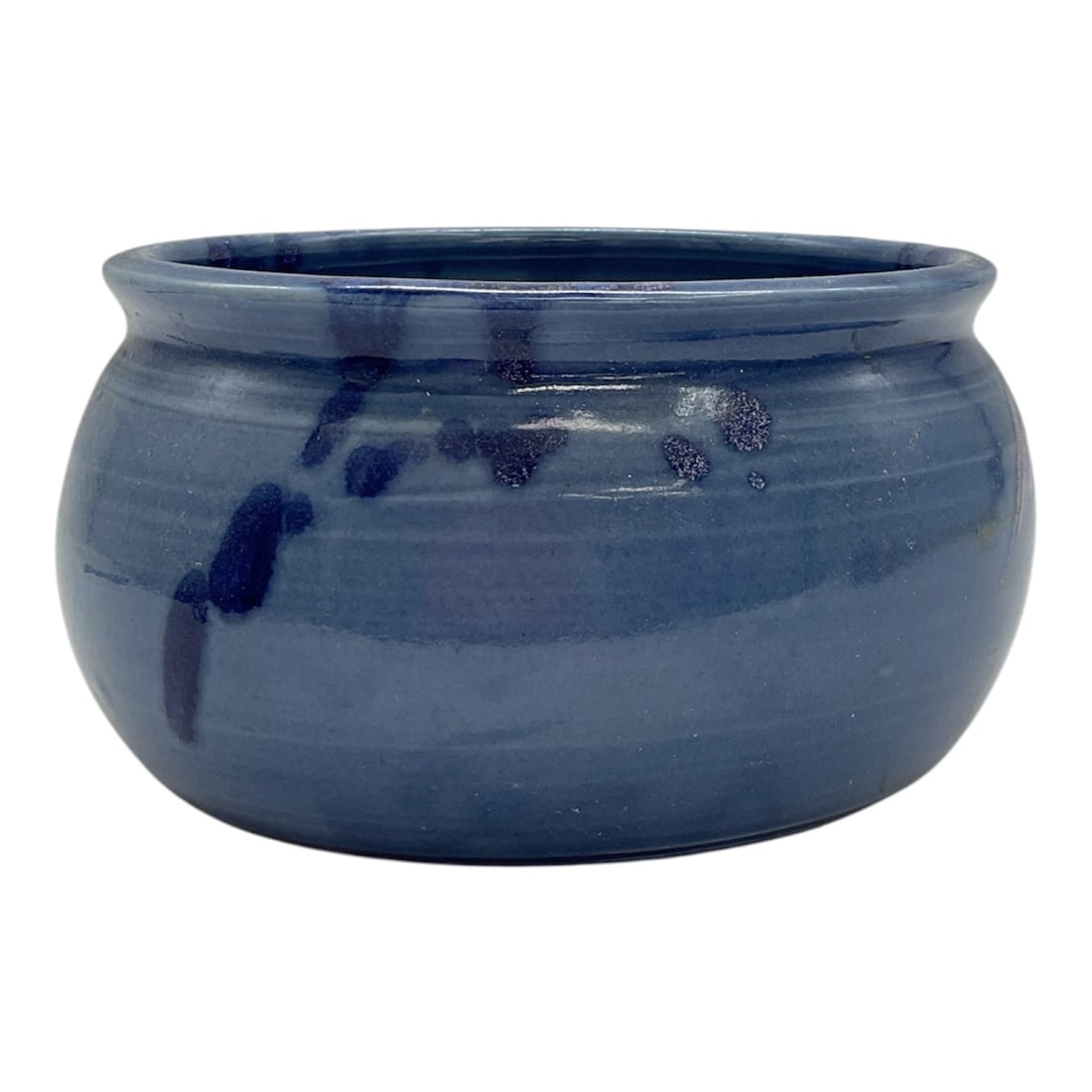 Blue Glazed Studio Pottery Bowl, Signed: Hand-thrown studio pottery bowl featuring a rich blue glaze with darker mottled spotting throughout the interior and exterior. Rounded form with slightly flared rim; underside bears an incised