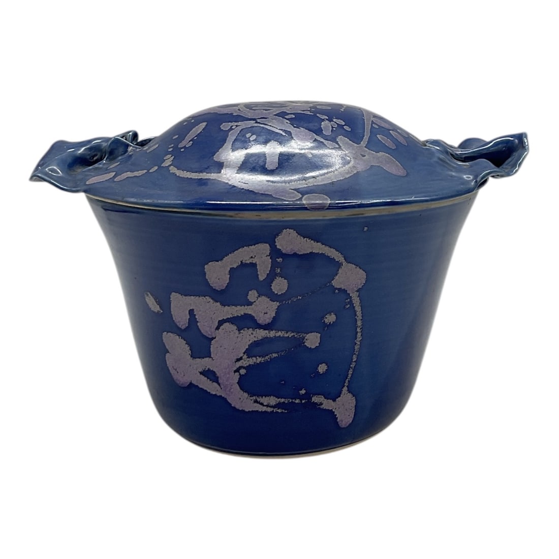 Covered Blue Glazed Pottery Dish, Signed: Hand-thrown pottery casserole with fitted lid and applied side handles. Finished in a rich cobalt blue glaze with abstract lavender splatter decoration across the body and lid. Interior glazed in deep