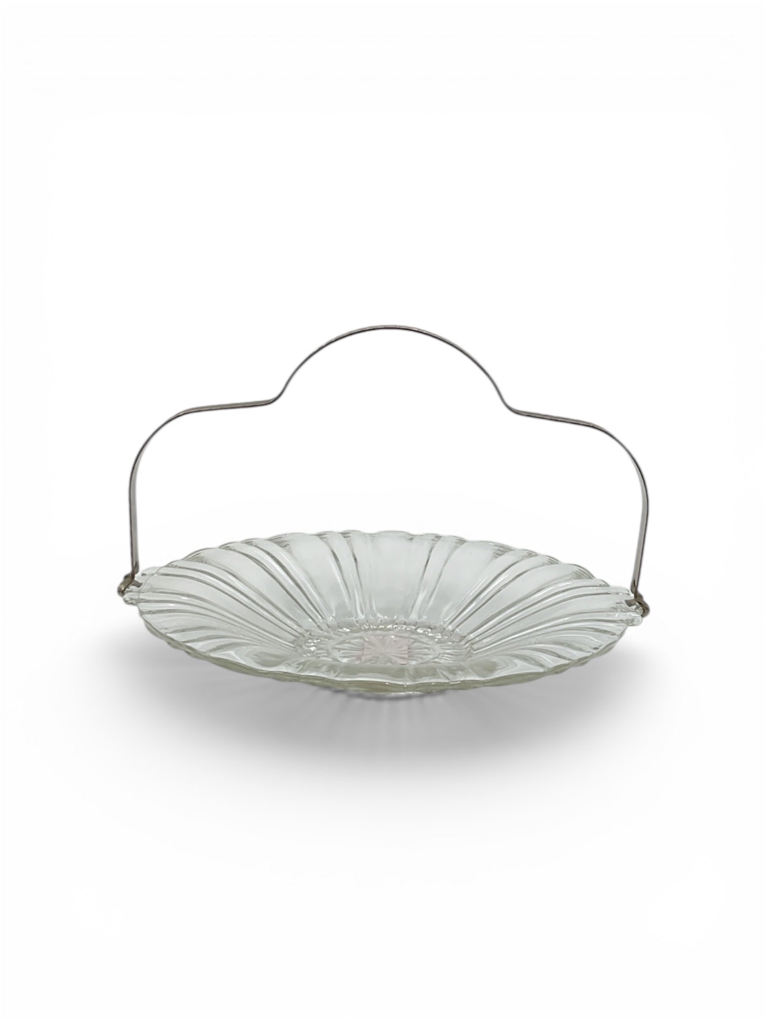 Handled Pressed Glass Serving Dish with Handle: Handled serving dish featuring a shallow, circular pressed glass bowl with radiating ribbed decoration and handle. The clear glass body displays a classic scalloped and fluted design, giving the piece