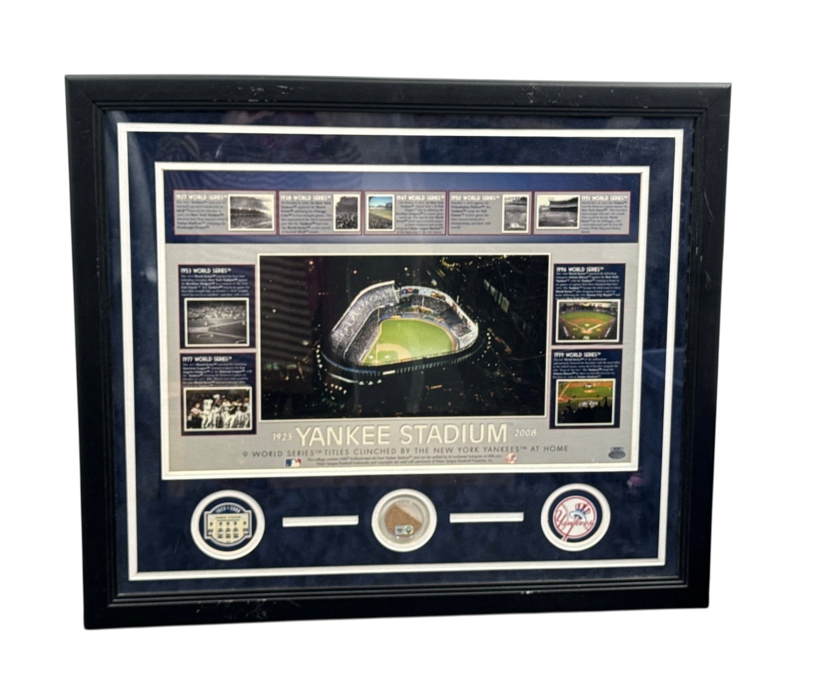 Yankee Stadium Framed Memorabilia Display with Steiner Authentication: This framed Yankee Stadium memorabilia display presents a detailed central aerial image of the iconic ballpark, surrounded by multiple inset photographs highlighting historic views and moments