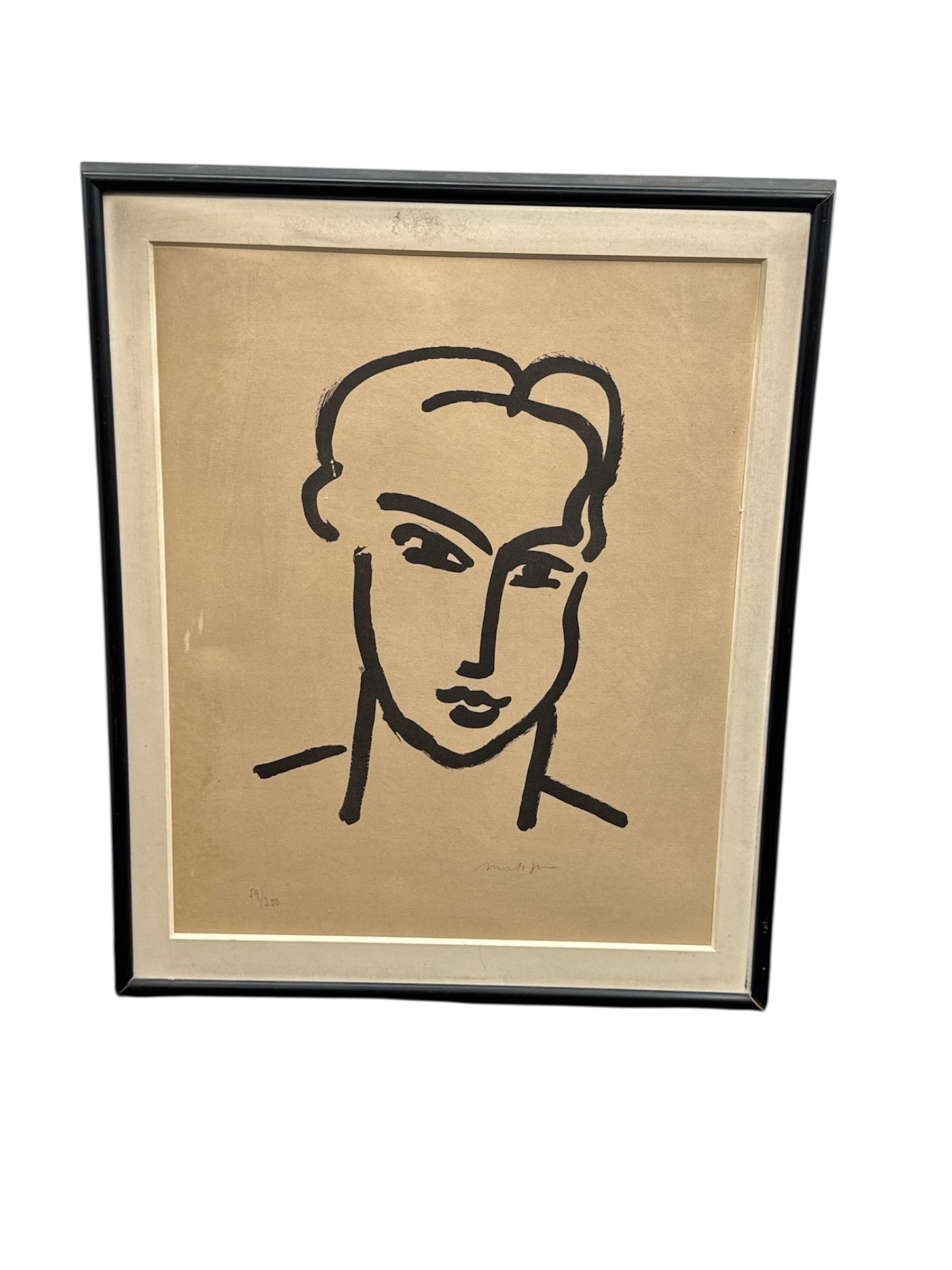 Modernist Portrait Print Attributed to Henri Matisse Signed and Numbered: Presented is a framed modernist portrait print attributed to Henri Matisse, featuring a bold, minimalist black line composition depicting a stylized human face. The work shows a pencil signature readi