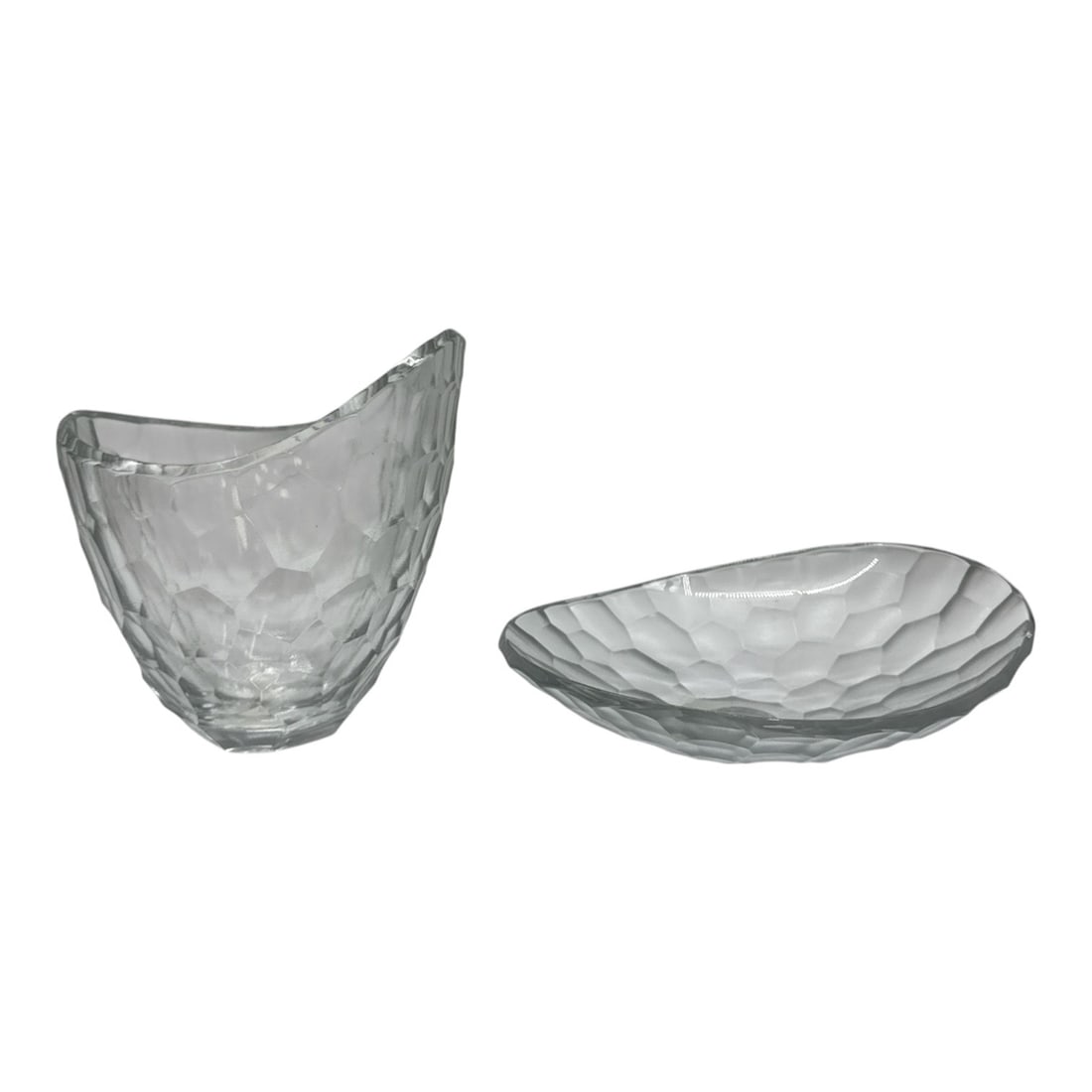Two Modern Textured Art Glass Bowls: Contemporary pair of clear art glass bowls featuring an organic hammered texture throughout. The larger bowl displays a sculptural asymmetrical form with a flowing rim, while the second bowl features
