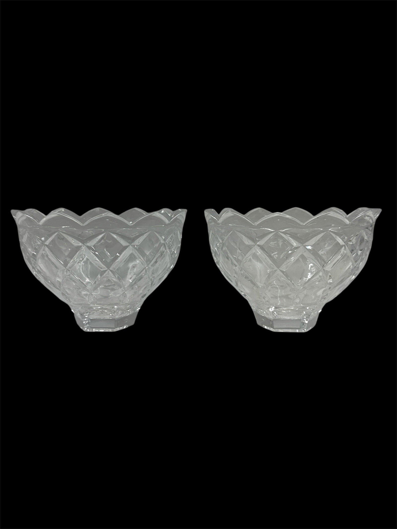 Pair of Cut Crystal Scalloped Serving Bowls with Diamond Pattern: Elegant pair of cut crystal serving bowls featuring a scalloped rim and deeply cut diamond lattice pattern throughout the body. The faceted surface enhances brilliance and light reflection, while the