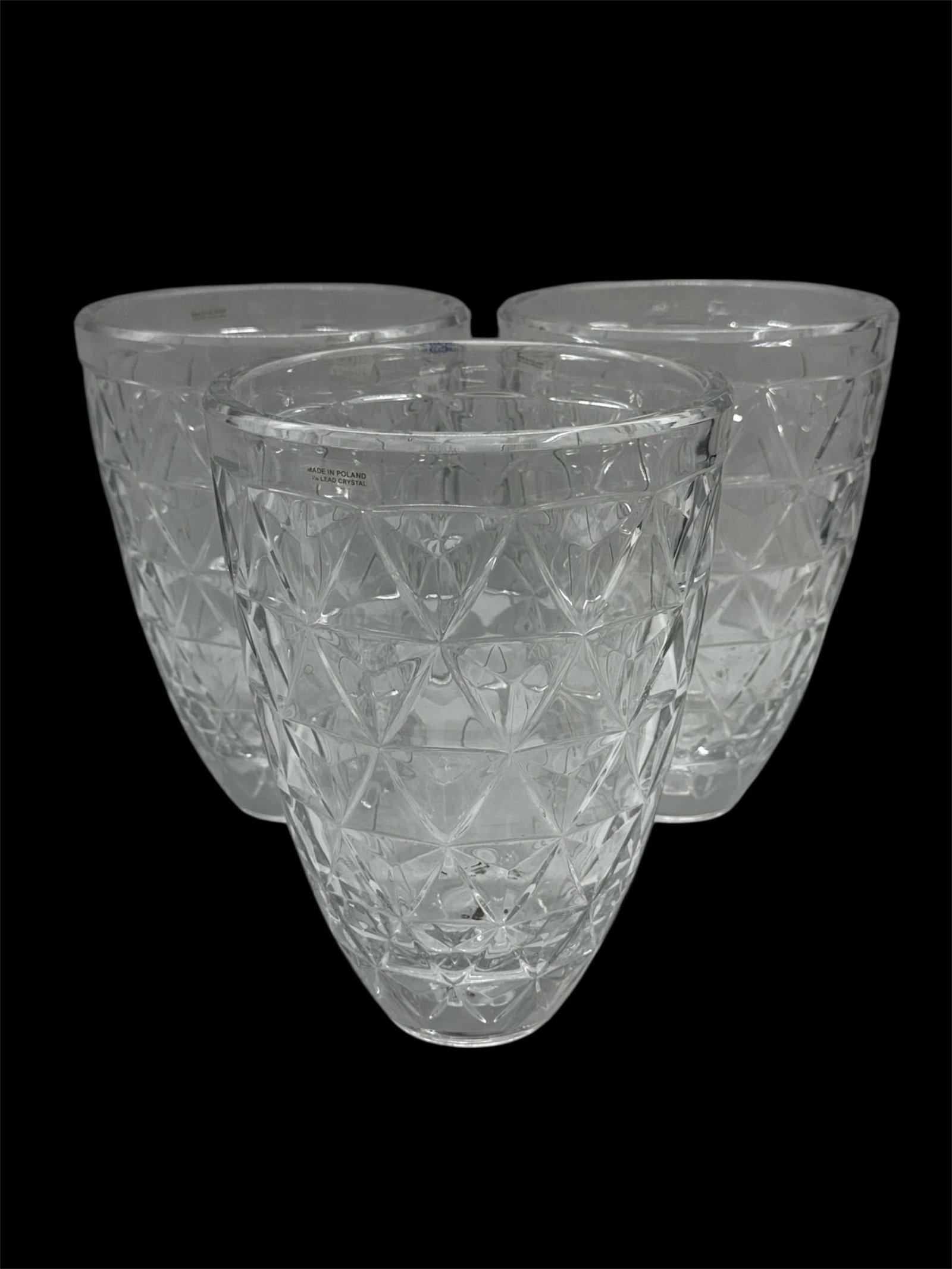 Set of Three Cut Crystal Vases with Geometric Pattern: Impressive set of three heavy cut crystal vases featuring an allover geometric lattice and star motif design. The deeply faceted pattern enhances brilliance and light refraction, while the gently