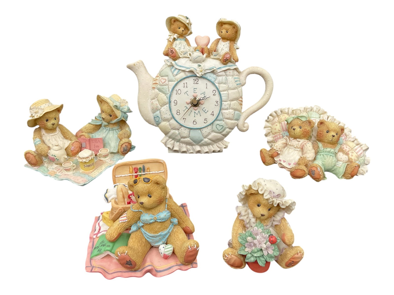 Cherished Teddies Figurine Group Including Freda and Tina Teapot Clock: A charming collection of Cherished Teddies resin figurines by Priscilla Hillman, featuring a variety of whimsical teddy bear scenes. The group includes multiple themed pieces such as picnic, floral, a