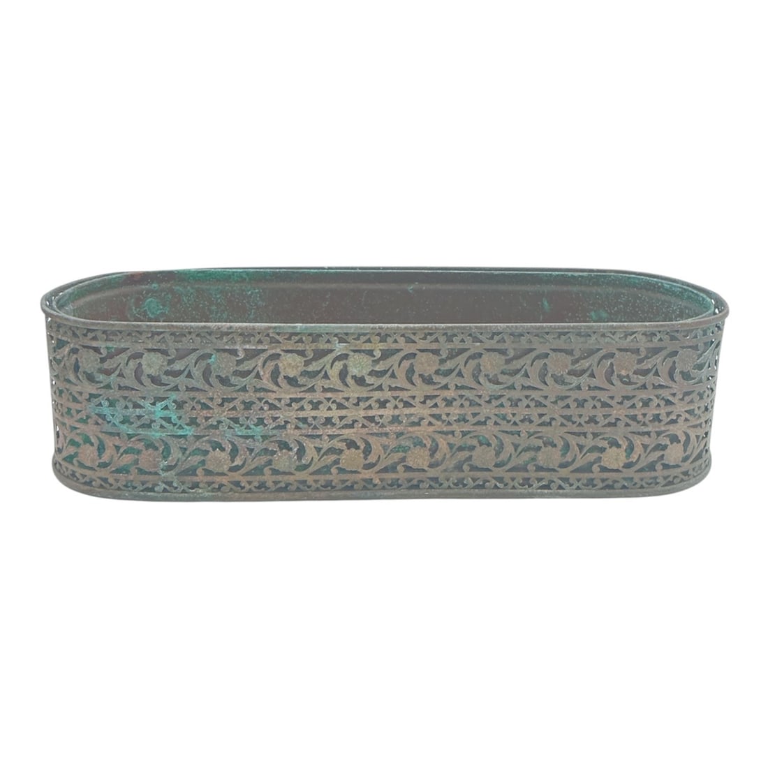 Vintage Pierced Metal Planter Box with Verdigris Patina: A vintage metal planter box featuring an elongat