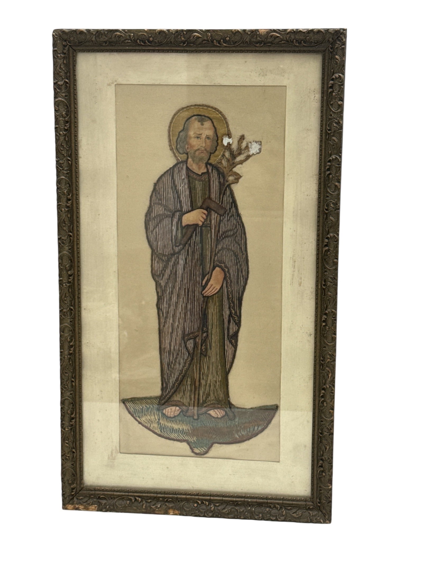 "St. Matthias" by Anonymous (Global, 19th-20th Century) Silk Embroidery on Fabric.: This antique textile work depicts St. Matthias, the apostle chosen to replace Judas Iscariot. The figure is rendered in a stylized, elongated form typical of liturgical or folk art traditions, holding