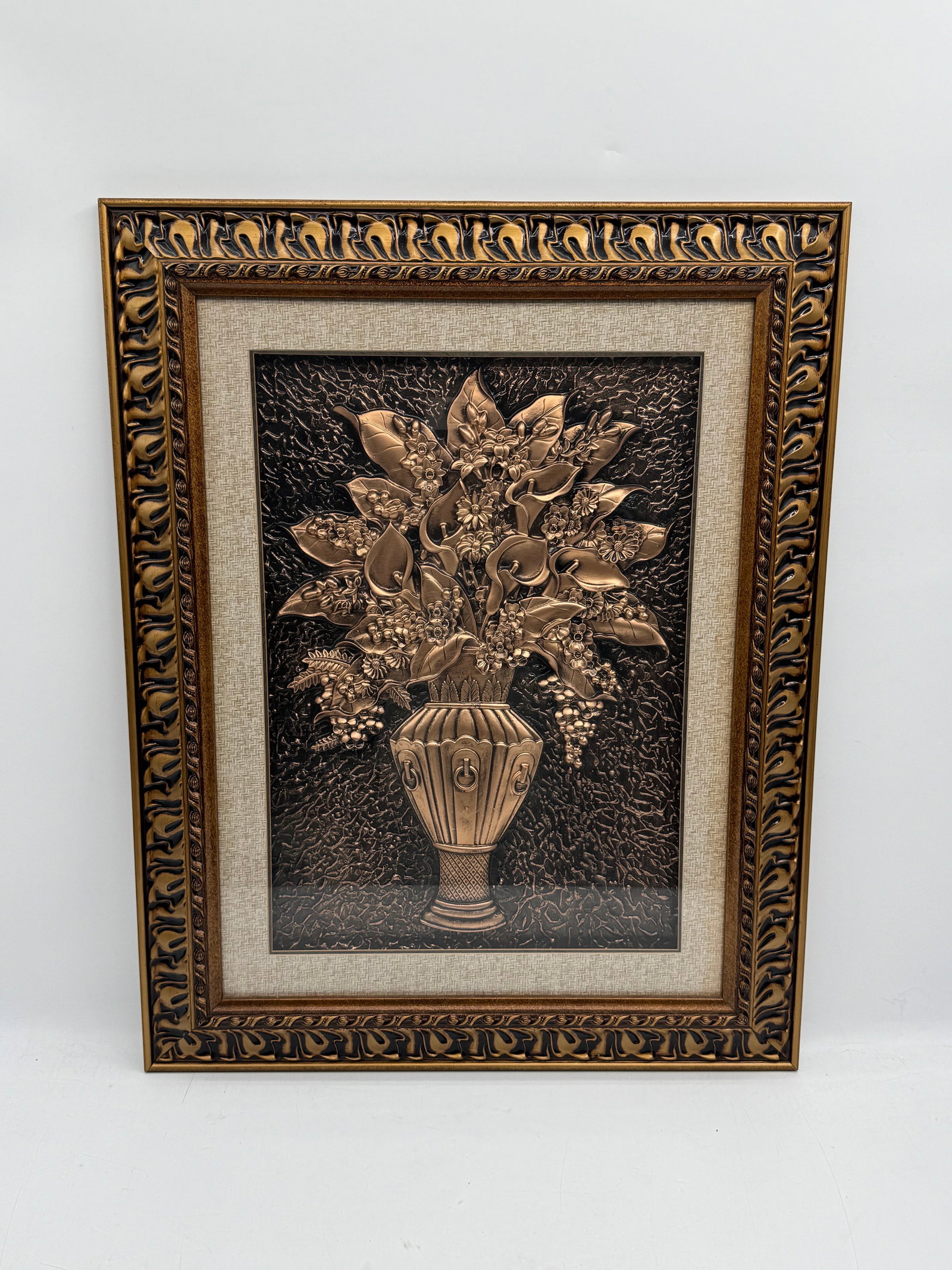 Framed Metal Relief Still Life - Vase and Flowers - EBAY: Framed metal relief depicting a still life of a vase with flowers and fruit. The artwork is presented in a decorative gold-tone frame. Dimensions: 32 x 25 inches.