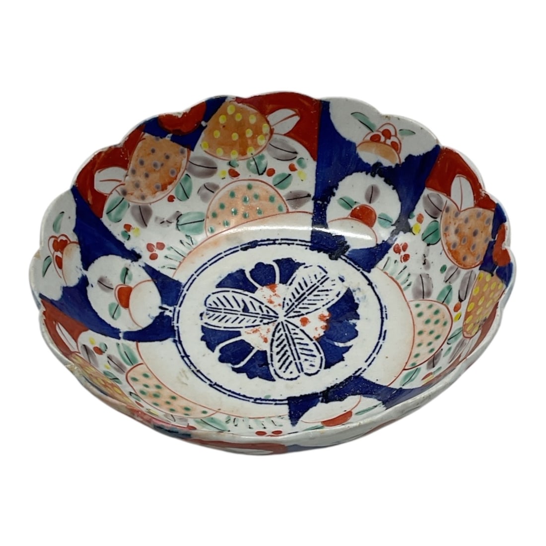 Japanese Imari Style Porcelain Bowl with Floral Decoration: Decorative porcelain bowl in the Imari style featuring a colorful hand-painted design in cobalt blue, iron red, and gilt tones. The interior is decorated with a central floral medallion surrounded by 