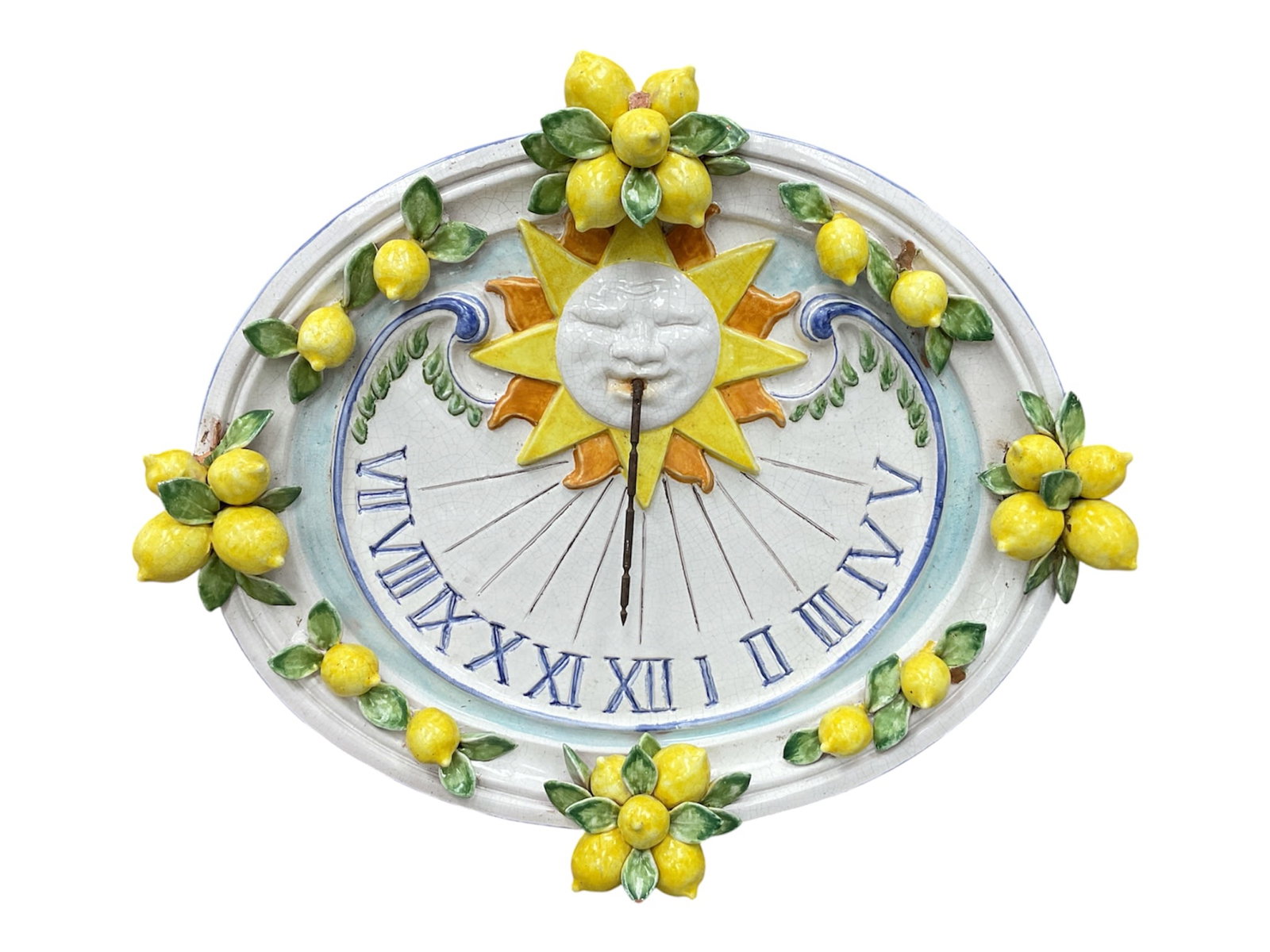Italian Majolica Lemon Sun Wall Sundial by Ceccarelli: Handcrafted Italian majolica wall sundial featuring a vibrant, high-relief design centered around a stylized sun face with radiating yellow and orange rays. The dial is encircled by hand-painted Roman