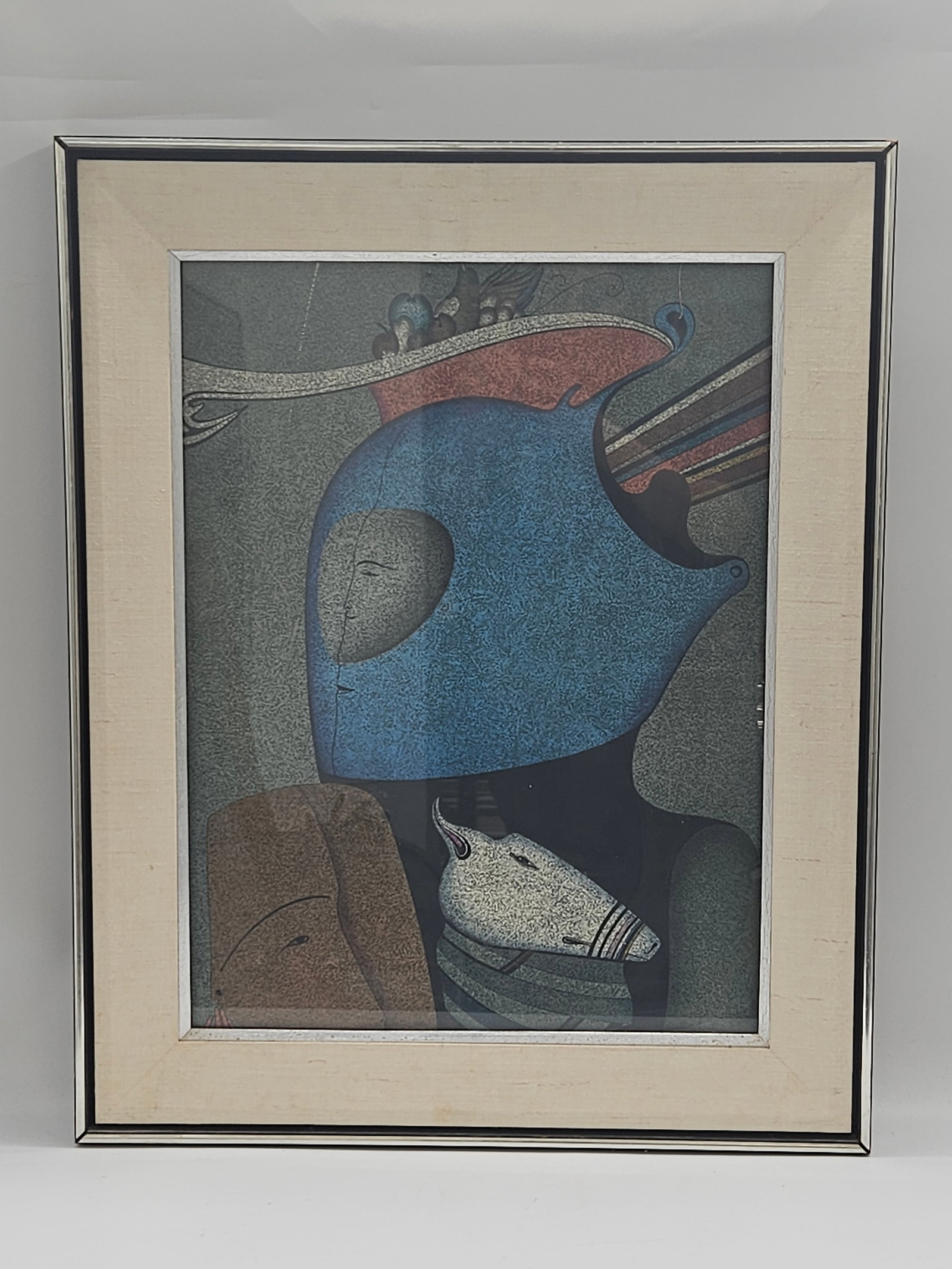 "Mask with Still life" Mihail Chemiakin (Russian, b.1943) Lithograph: Description: A framed surrealist print inspired by the works of Marc Chagall, featuring a dreamlike figure rendered in soft blues and muted earth tones. The composition exhibits Chagall’s signa