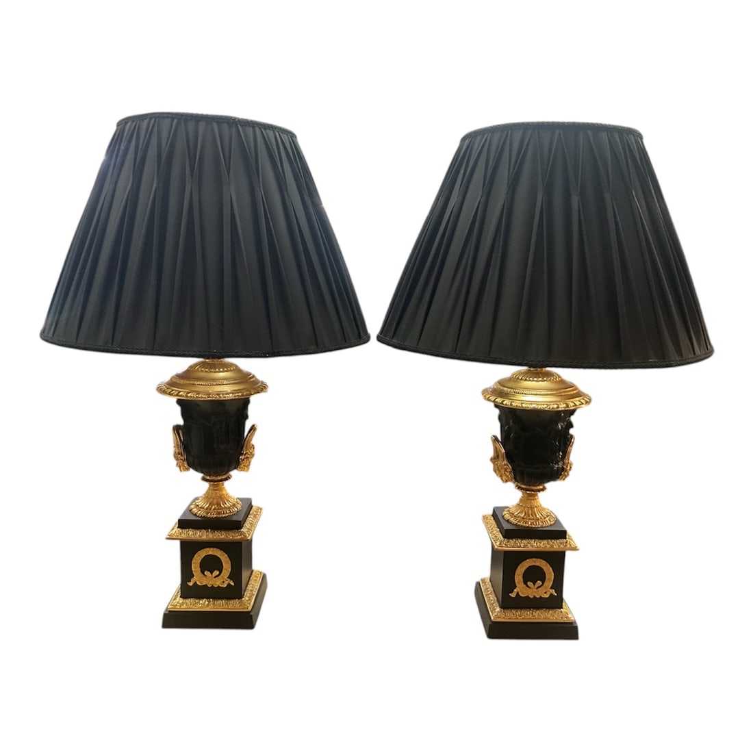 LM-083 Pair of Empire Style Dore Bronze Mounted Table Lamps with Black Shades: A striking pair of Empire style table lamps featuring richly detailed dore bronze mounts set against contrasting black bodies, exemplifying classical French-inspired design. Each lamp is constructed w