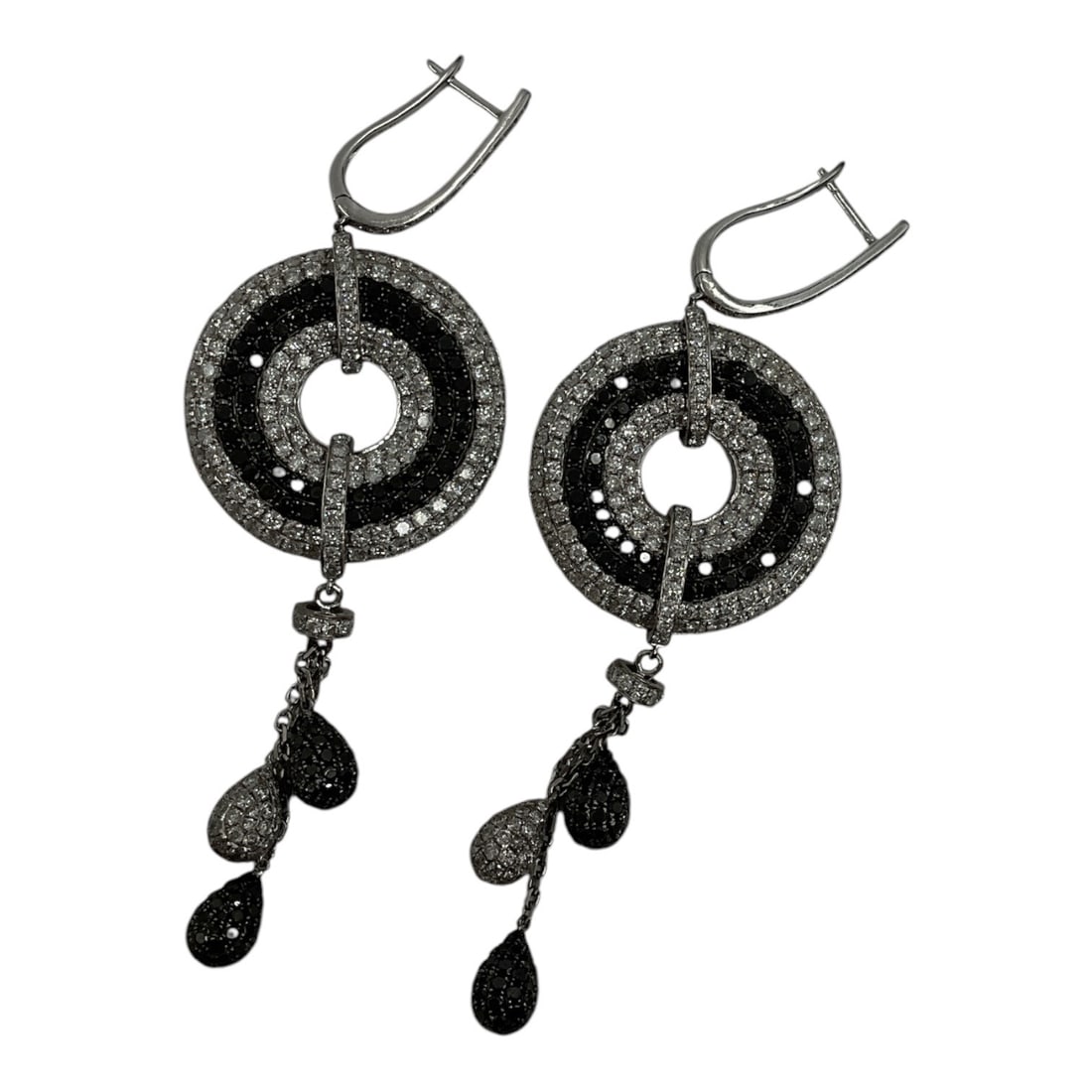 Pair of Black and White Diamond Drop Disc Earrings: A striking pair of drop earrings featuring concentric disc motifs set with black and white natural diamonds. Each earring is designed with circular openwork elements suspended from diamond-set connect