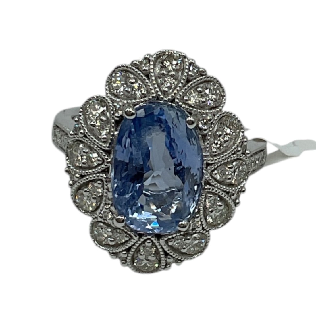Platinum Blue Sapphire and Diamond Ring with Appraisal: An ornate platinum ring set with a large oval-cut
