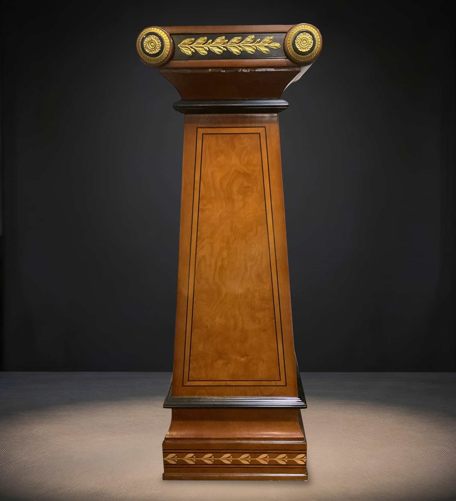 PD050 - Empire Wood Pedestal with Dore Bronze Mounts: A finely crafted Empire style pedestal executed in richly figured wood and accented with elegant dore bronze mounts. The pedestal features a tapered architectural form, with clean lines and balanced p