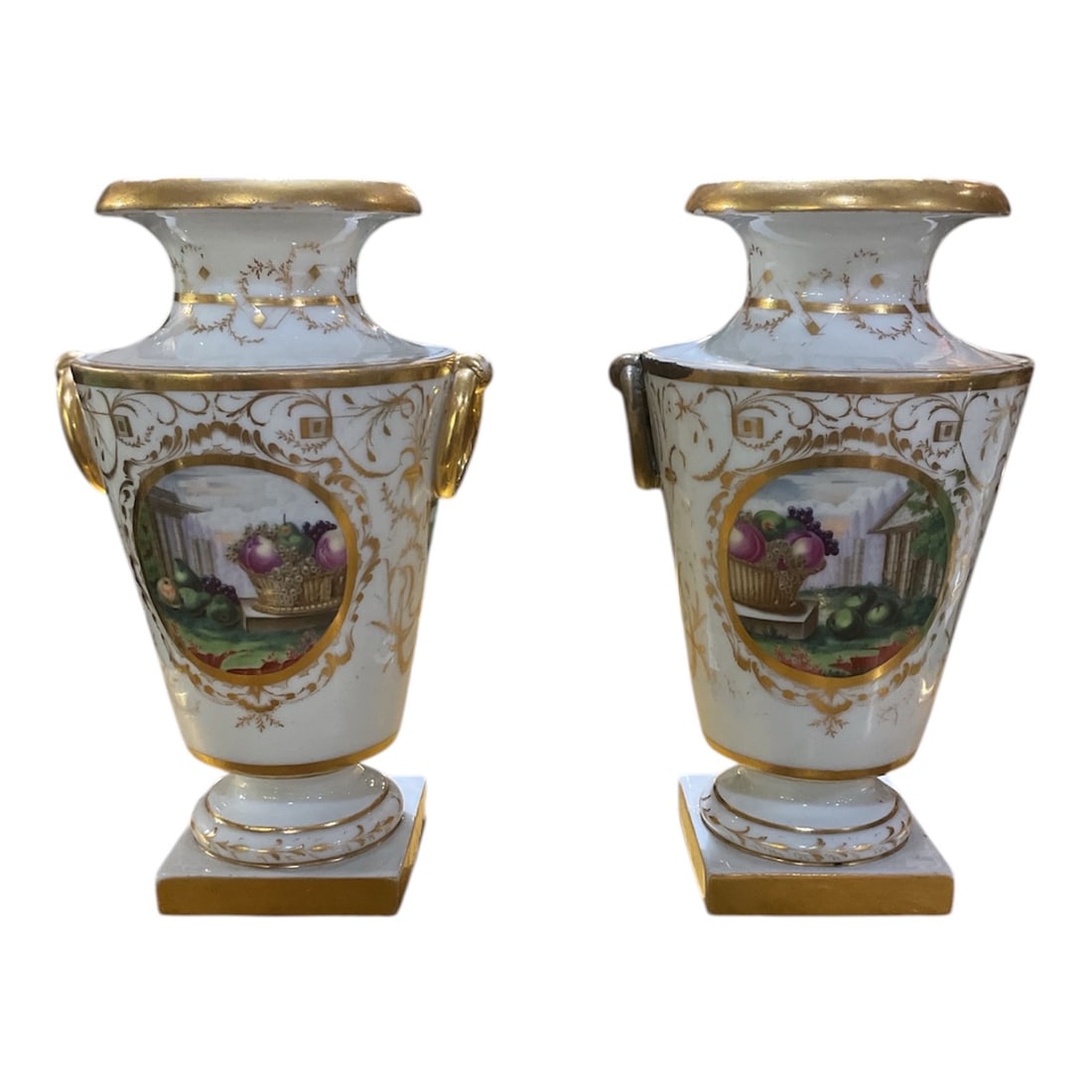 PC661 - Pair of 19th Century Old Paris Porcelain Vases with Hand-Painted Landscape Reserves: A refined pair of Old Paris porcelain vases executed in the 19th century style, featuring elegant baluster forms richly decorated with hand-painted landscape scenes and extensive gilt detailing. Each 