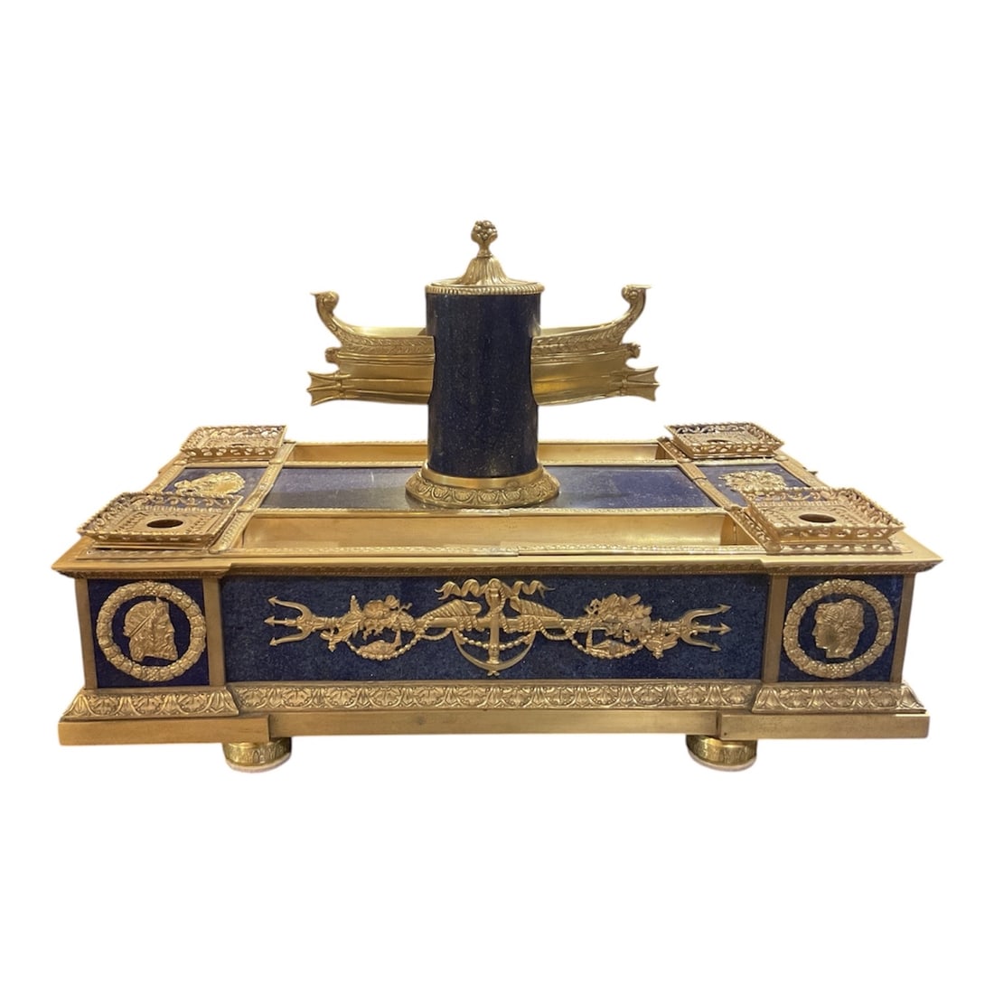 LC090 - Lapis Lazuli and Dore Bronze Desk Inkwell in the Empire Taste: A finely executed desk inkwell crafted in the Empire style, featuring richly colored lapis lazuli panels combined with elaborate dore bronze mounts and classical decorative elements. The rectangular f
