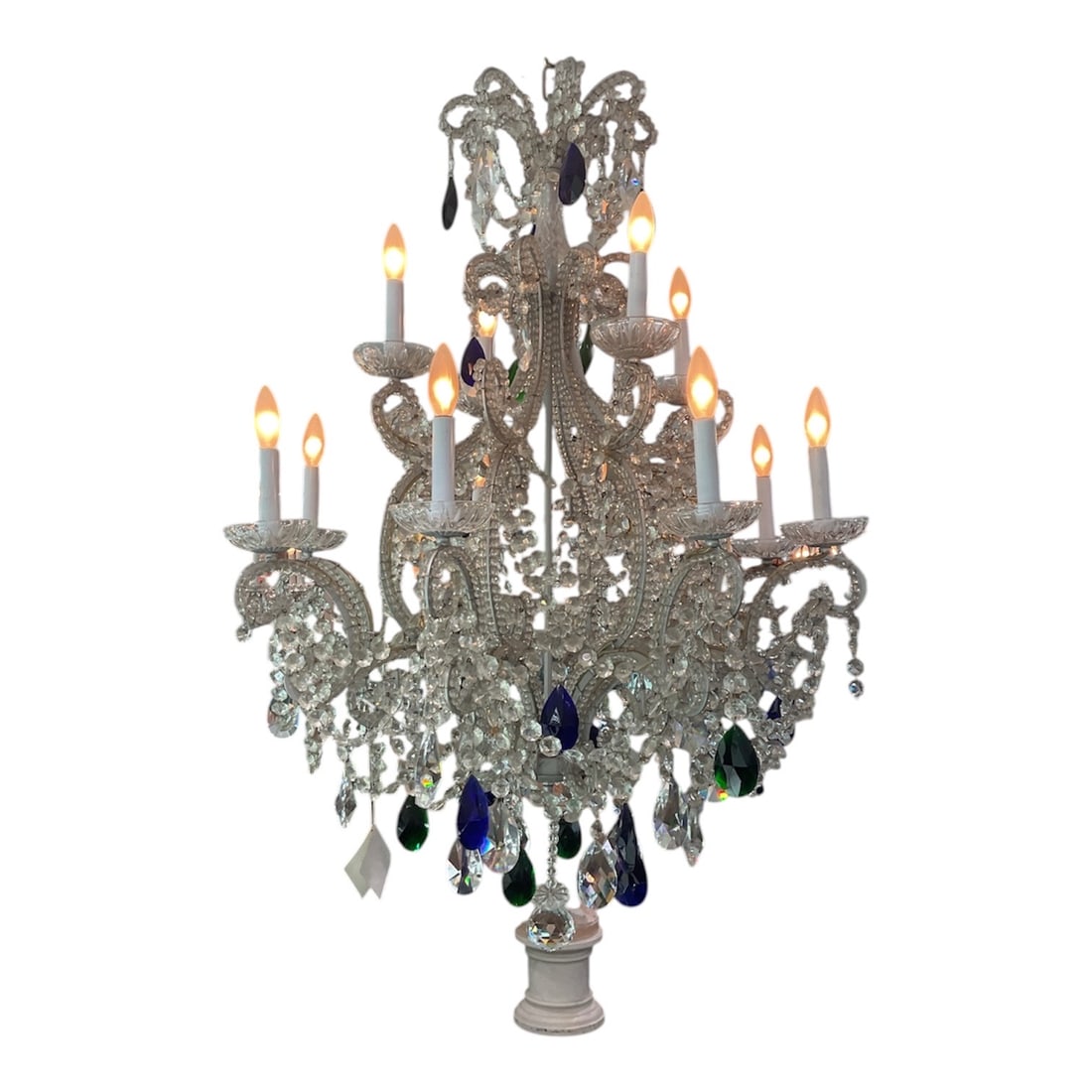 CH201 - 12-Light Crystal Chandelier with Blue Accent Drops: An elaborate 12-light chandelier featuring a richly decorated crystal framework enhanced with striking blue accent drops. This impressive lighting fixture showcases a multi-tiered design, combining cl