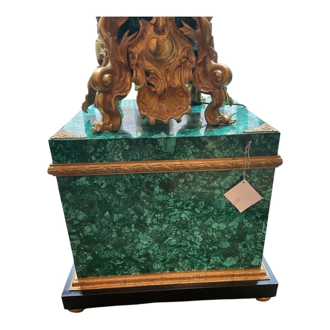 MC221 - Pair of Malachite and Dore Bronze Pedestals: A monumental pair of pedestals executed in the grand Russian Imperial style, featuring richly veneered malachite bodies accented with finely cast dore bronze mounts. These pedestals are designed to su