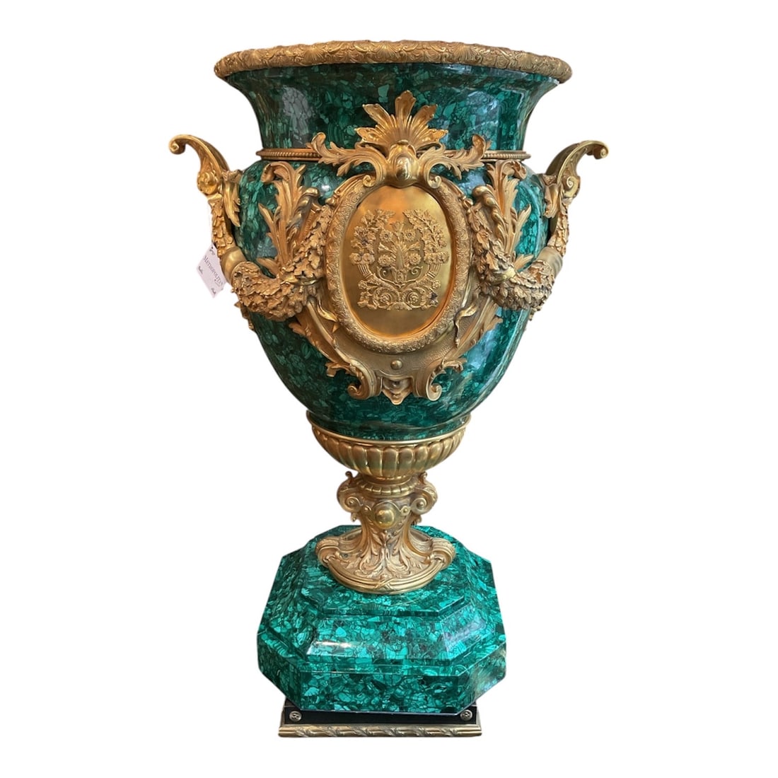 MC190 - Pair of Russian Imperial Malachite and Dore Bronze Urns: A magnificent pair of Russian Imperial monumental urns, featuring rich malachite bodies adorned with elaborate dore bronze mounts. These pieces exemplify opulence, scale, and exceptional craftsmanship