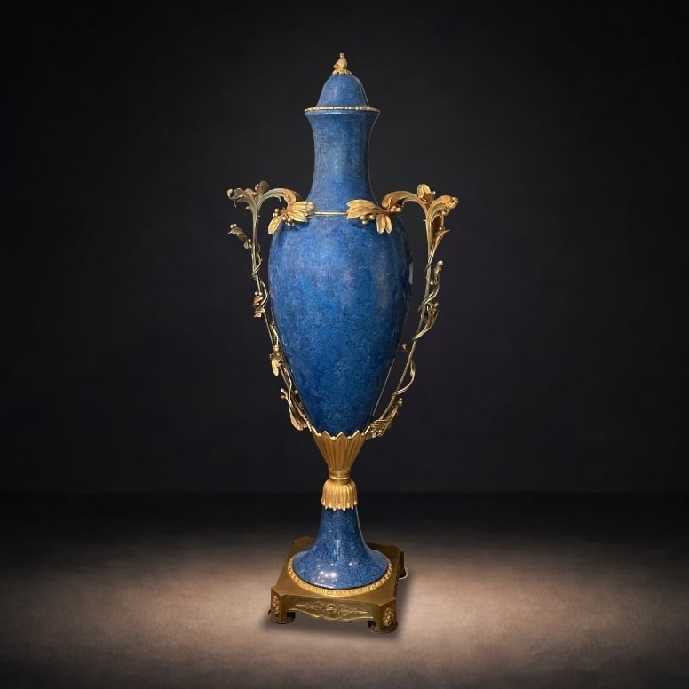 LC122 - Pair of Lapis and Dore Bronze Mounted Vases: An impressive pair of monumental vases crafted in richly colored lapis and adorned with finely cast dore bronze mounts, exemplifying the grandeur of neoclassical design. These striking decorative obje
