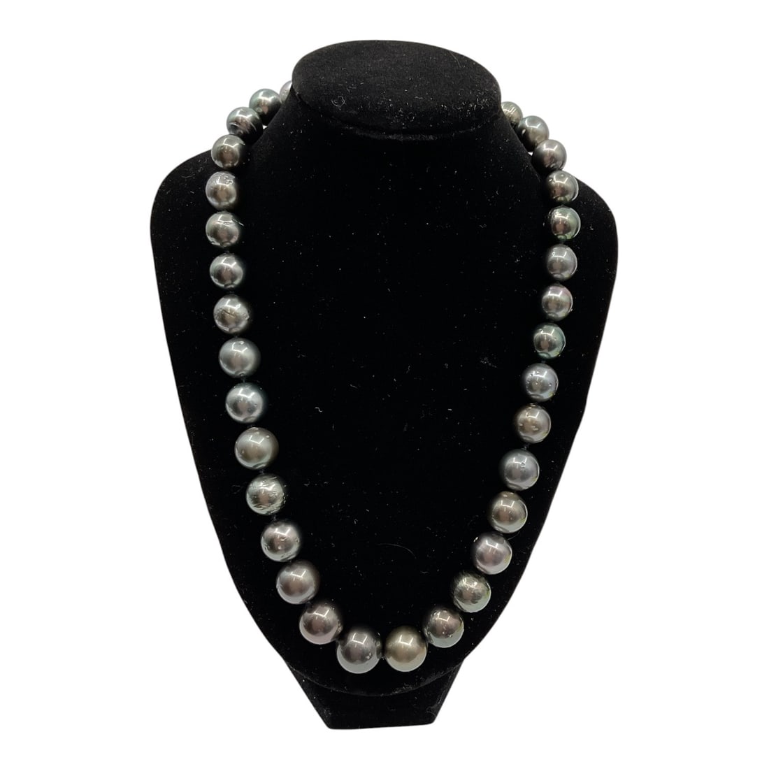 Tahitian Pearl Necklace with AIGL Appraisal: An elegant strand necklace composed of Tahitian cultured pearls, displaying a rich range of dark tones with subtle overtones. The pearls exhibit a lustrous surface and are graduated in size, creating 